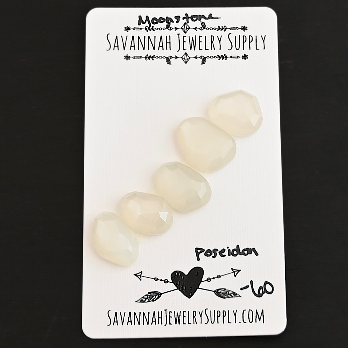 Poseidon Rose Cut Moonstone Cabochon Parcel shown on business card