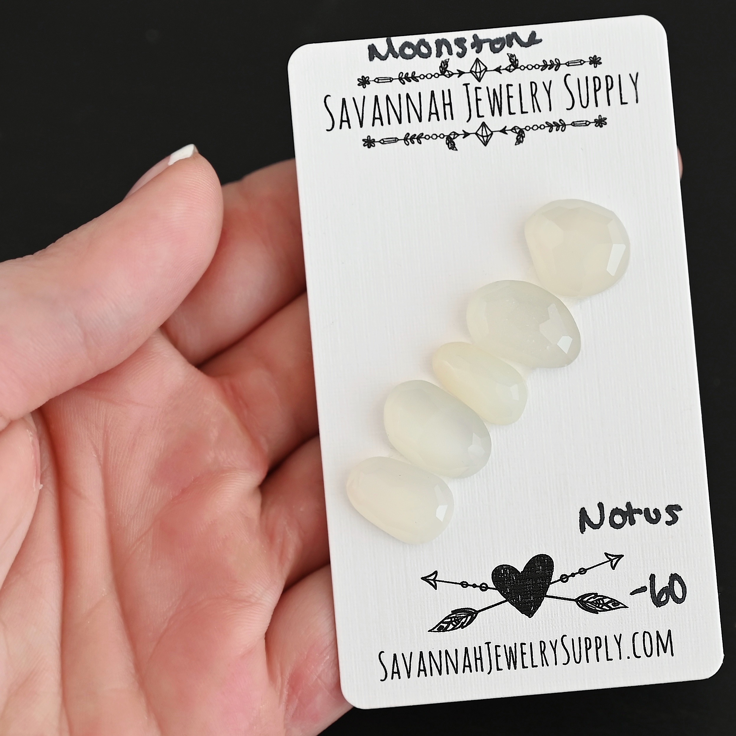 Notus Rose Cut Moonstone Cabochon Parcel shown in hand