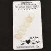 Ourea Rose Cut Moonstone Cabochon Parcel shown on business card