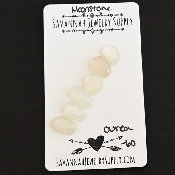 Ourea Rose Cut Moonstone Cabochon Parcel shown on business card