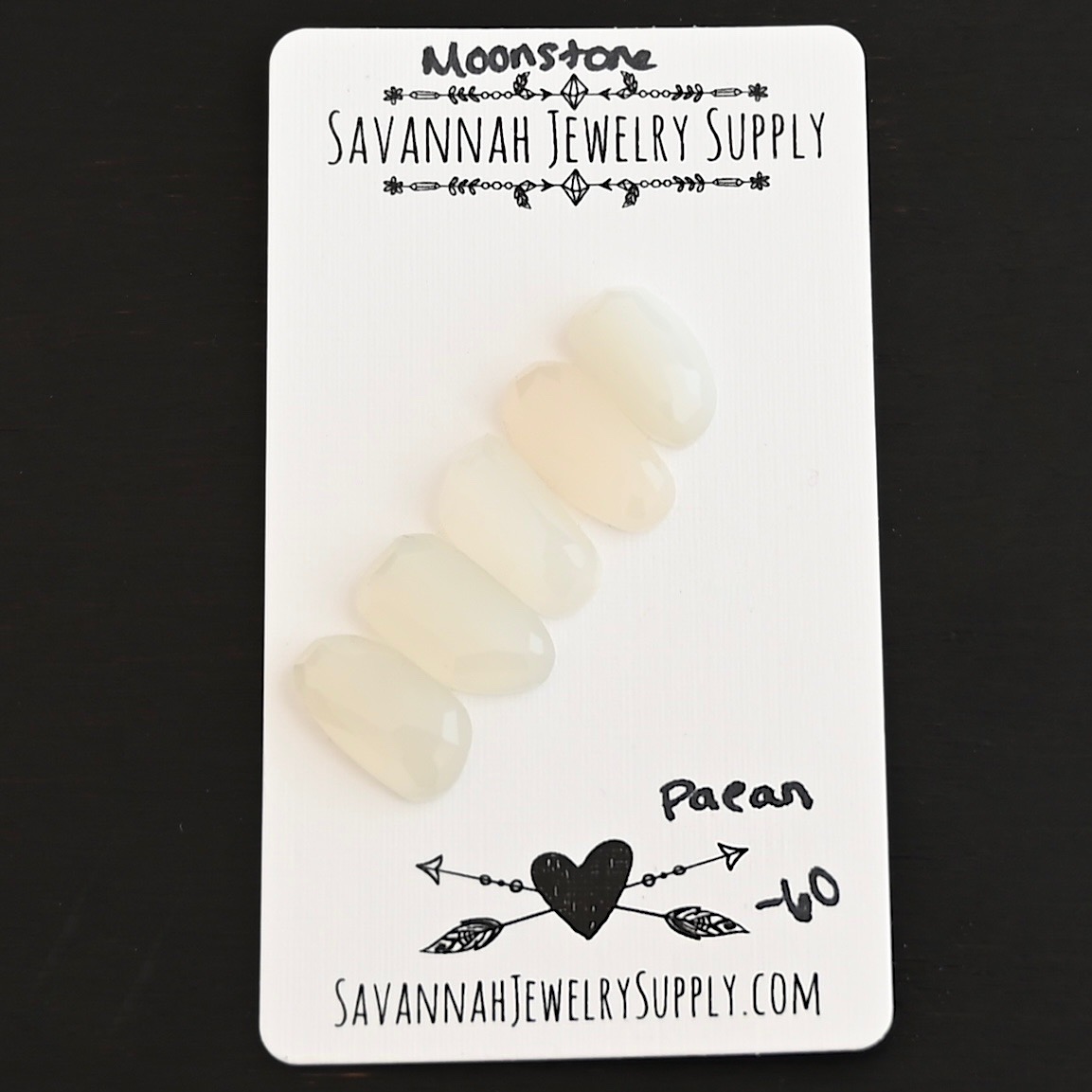 Paean Rose Cut Moonstone Cabochon Parcel shown on business card