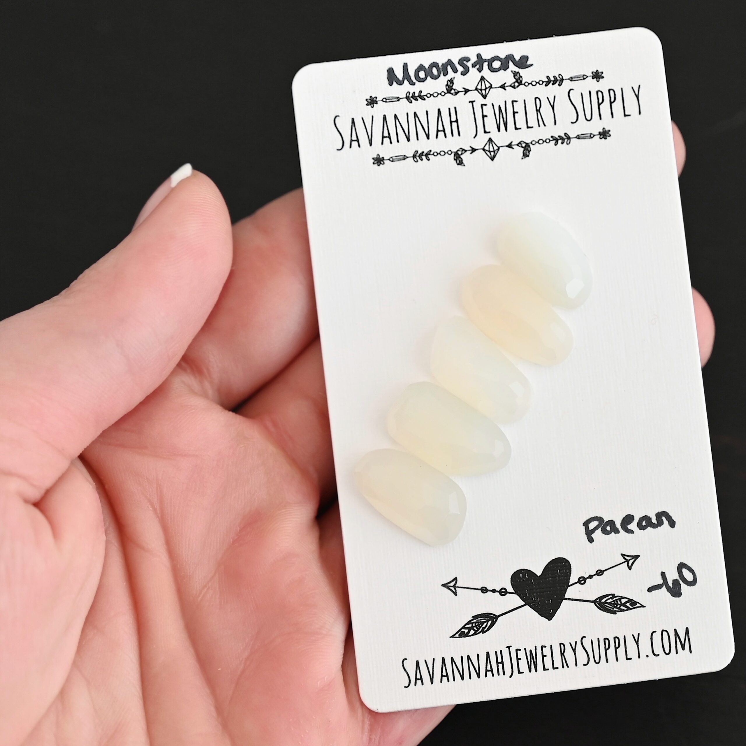 Paean Rose Cut Moonstone Cabochon Parcel shown in hand