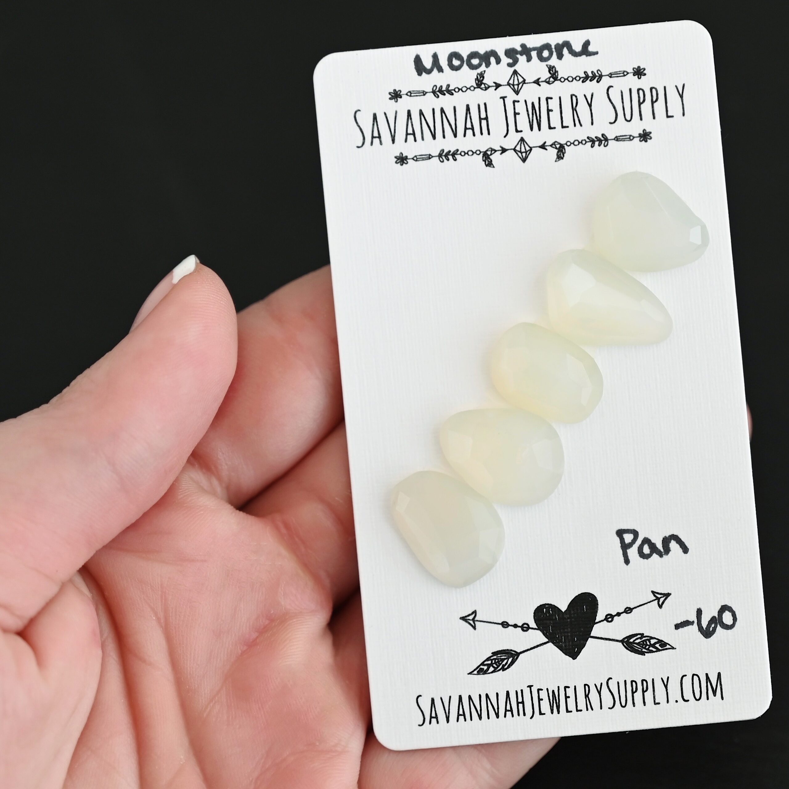 Pan Rose Cut Moonstone Cabochon Parcel shown in hand