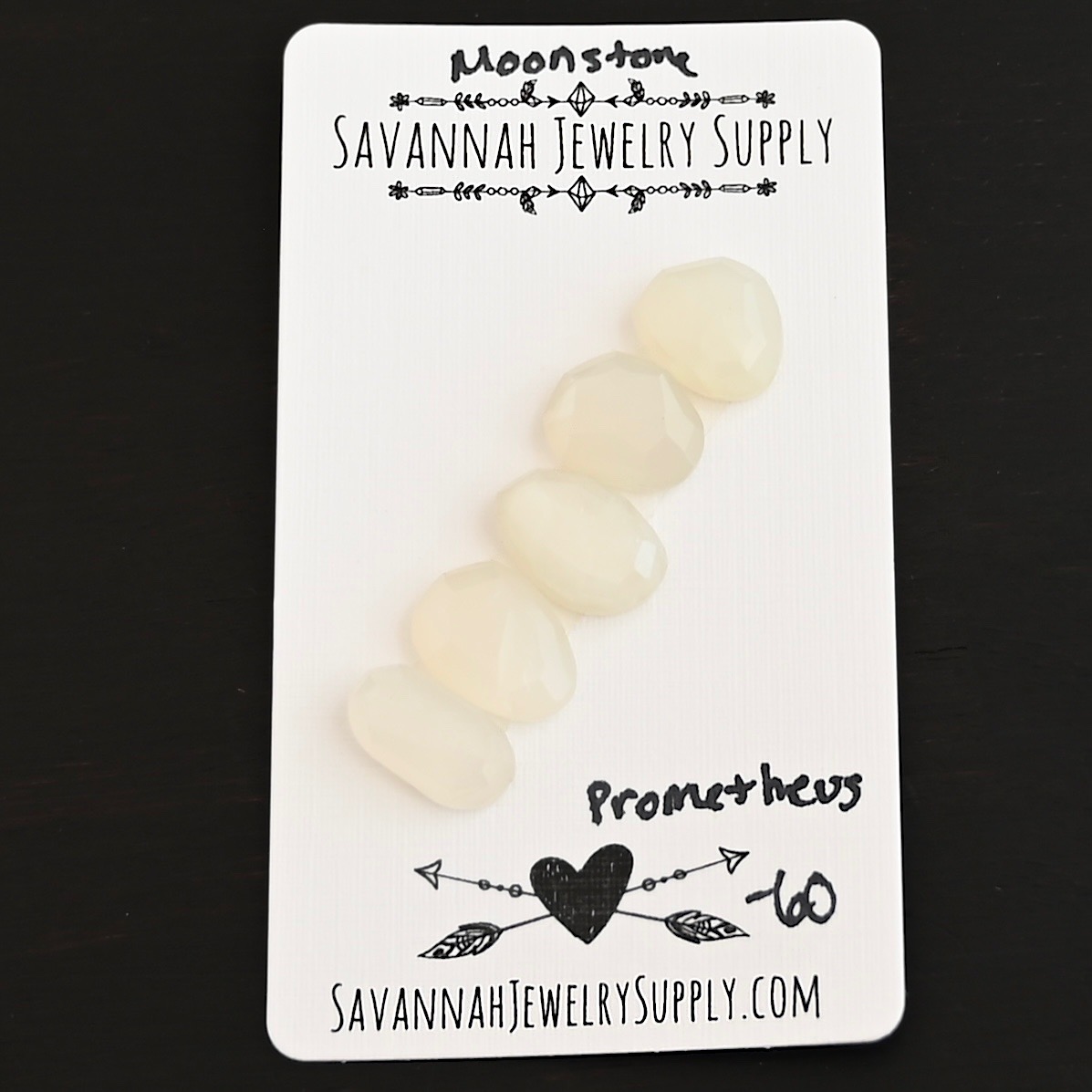 Prometheus Rose Cut Moonstone Cabochon Parcel shown on business card