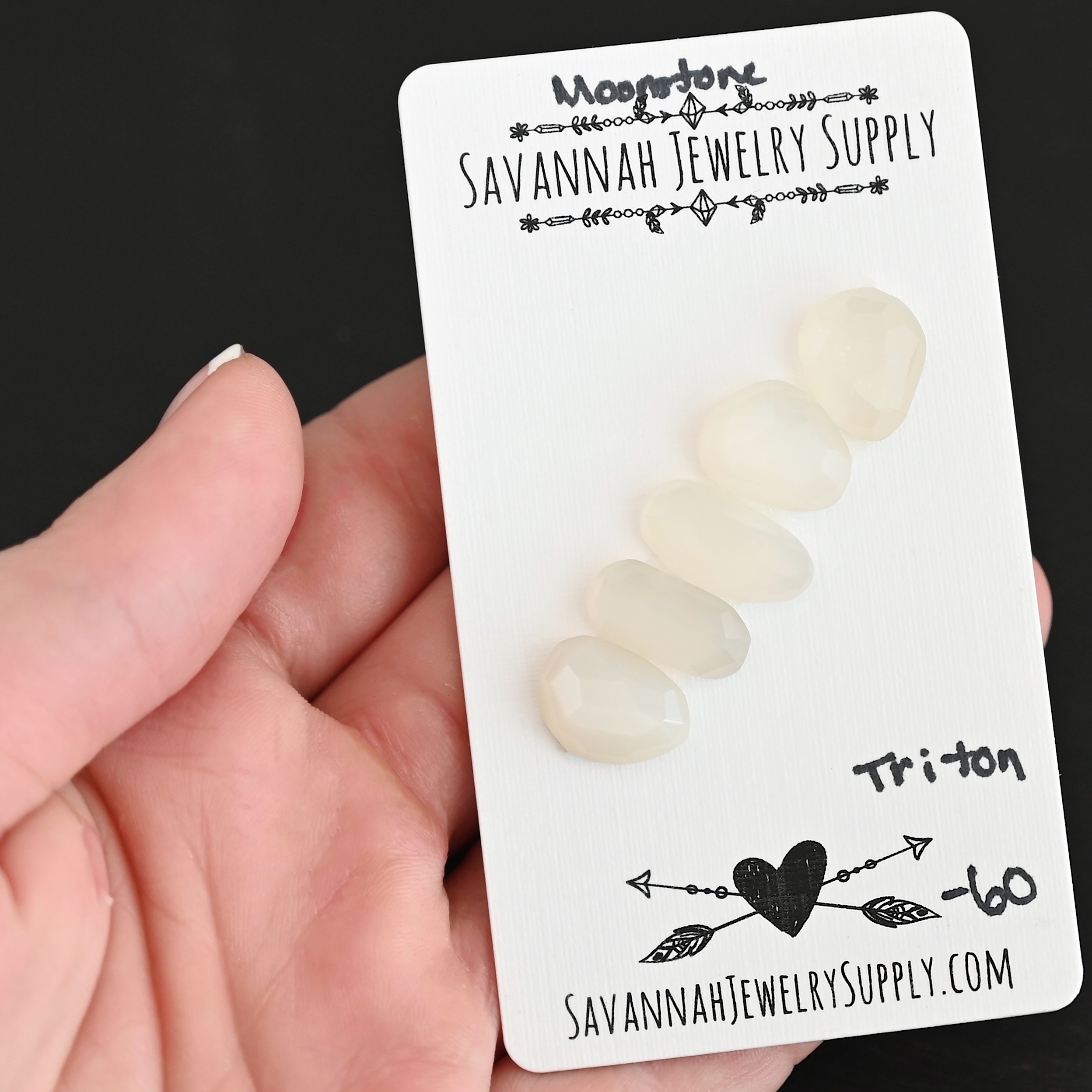 Triton Rose Cut Moonstone Cabochon Parcel shown in hand