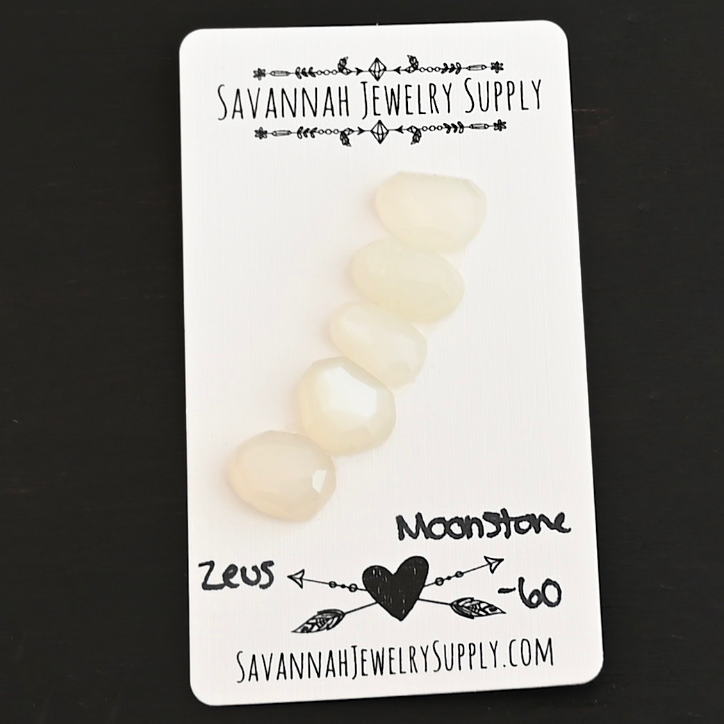 Zeus Rose Cut Moonstone Cabochon Parcel shown on business card