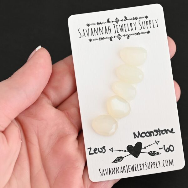Zeus Rose Cut Moonstone Cabochon Parcel shown in hand