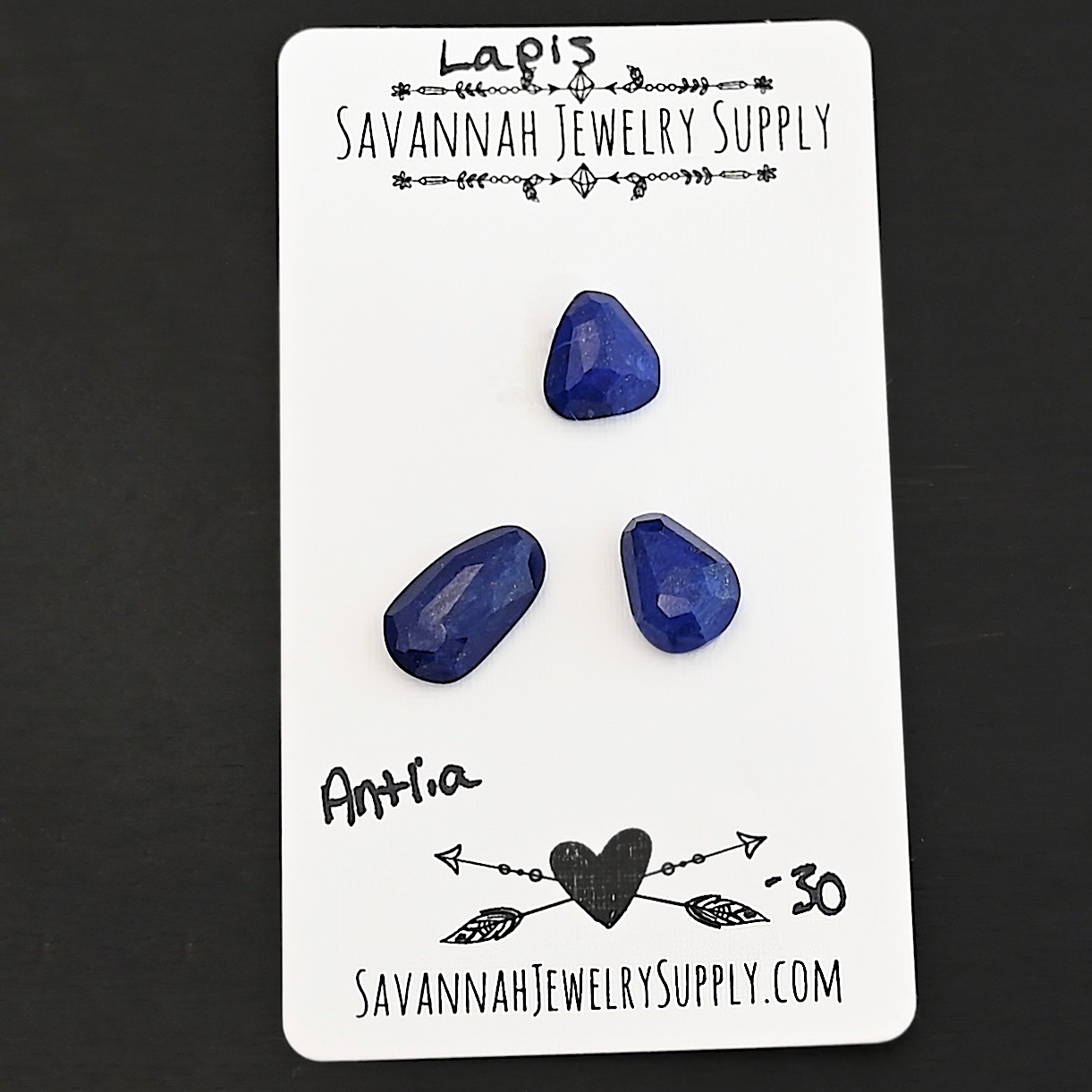 Antlia Rose Cut Lapis Cabochon Parcel shown on business card