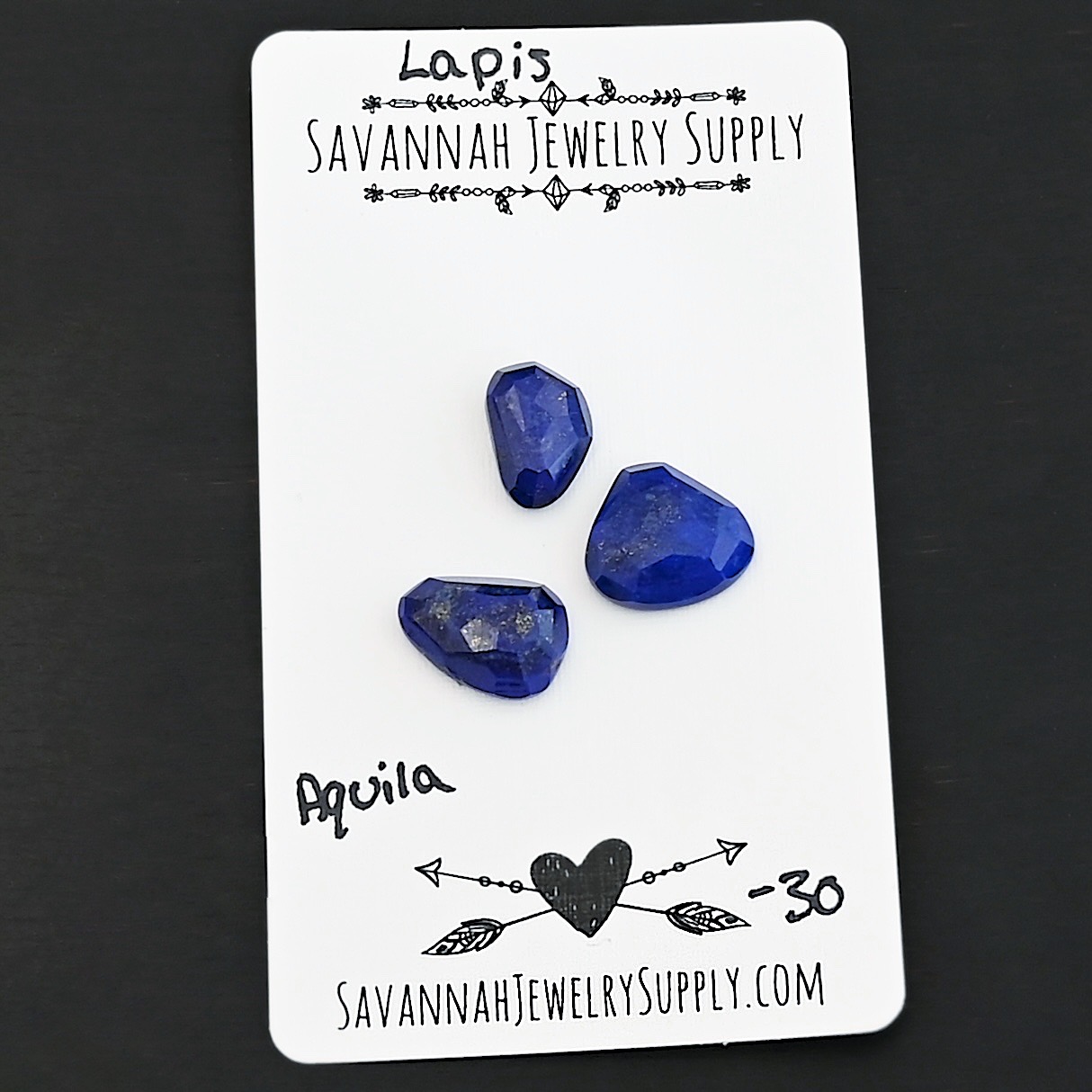 Aquila Rose Cut Lapis Cabochon Parcel shown on business card