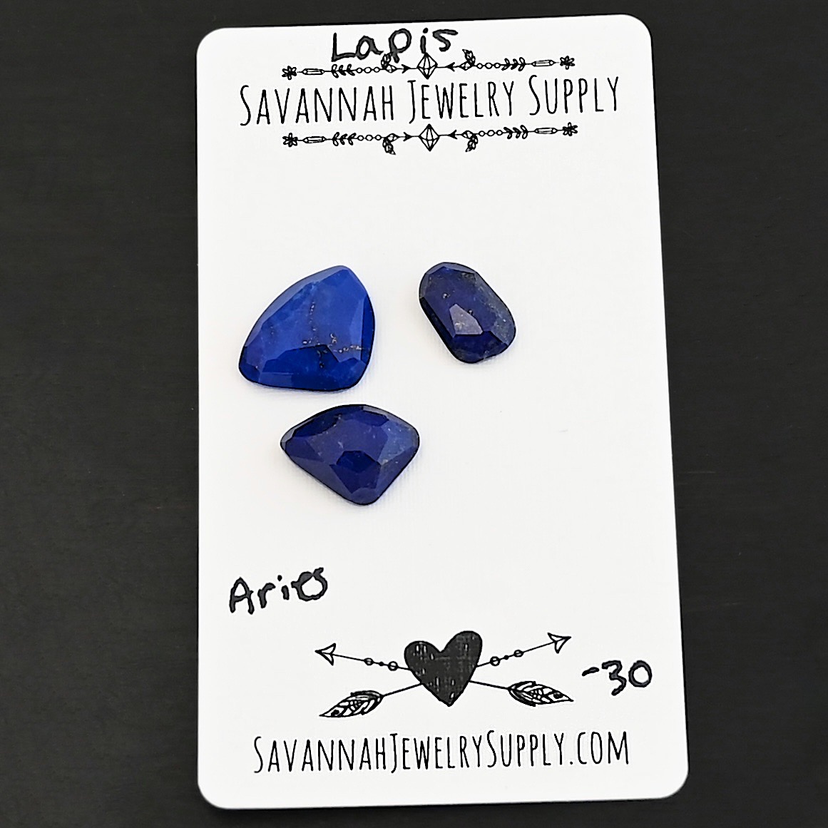 Aries Rose Cut Lapis Cabochon Parcel shown on business card