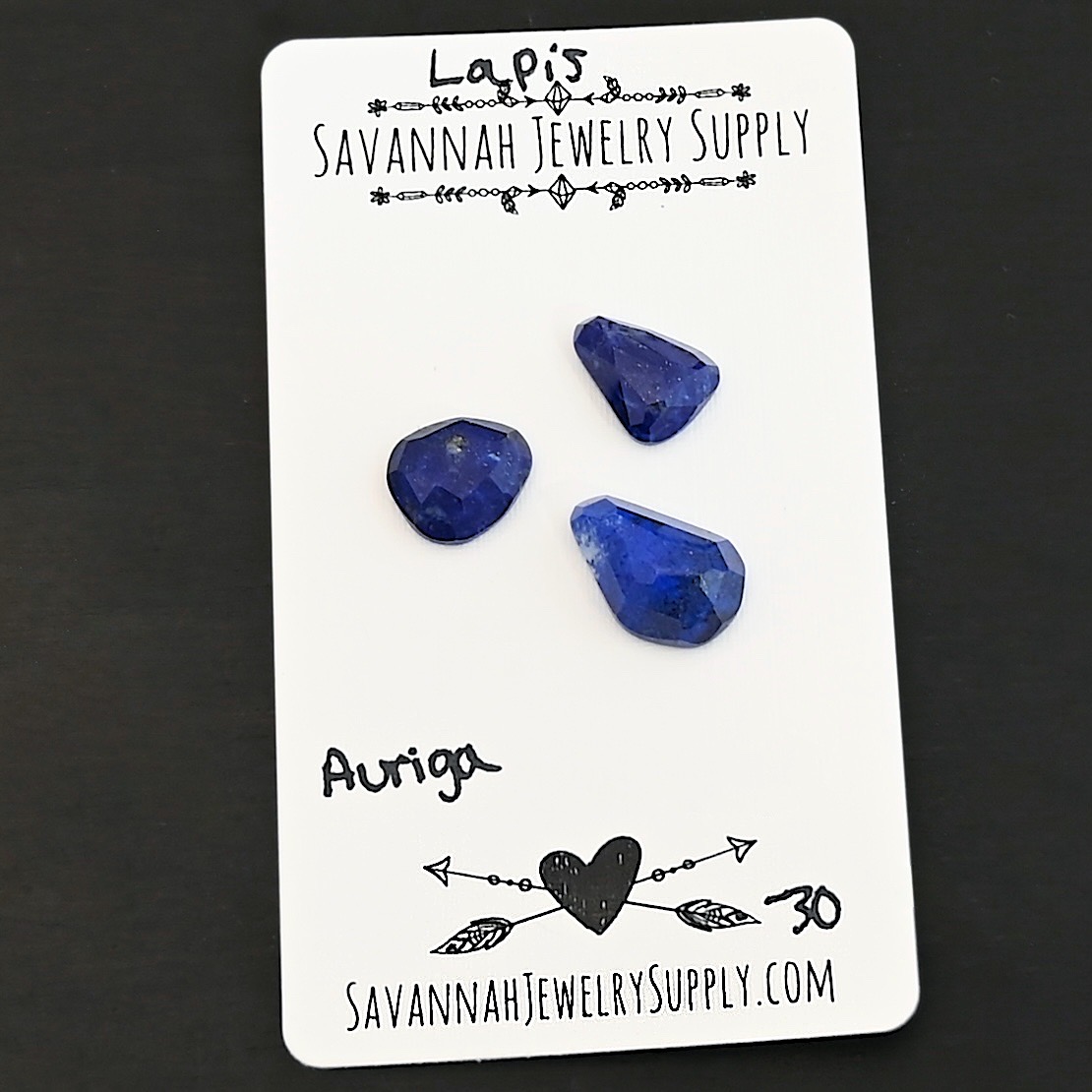 Auriga Rose Cut Lapis Cabochon Parcel shown on business card