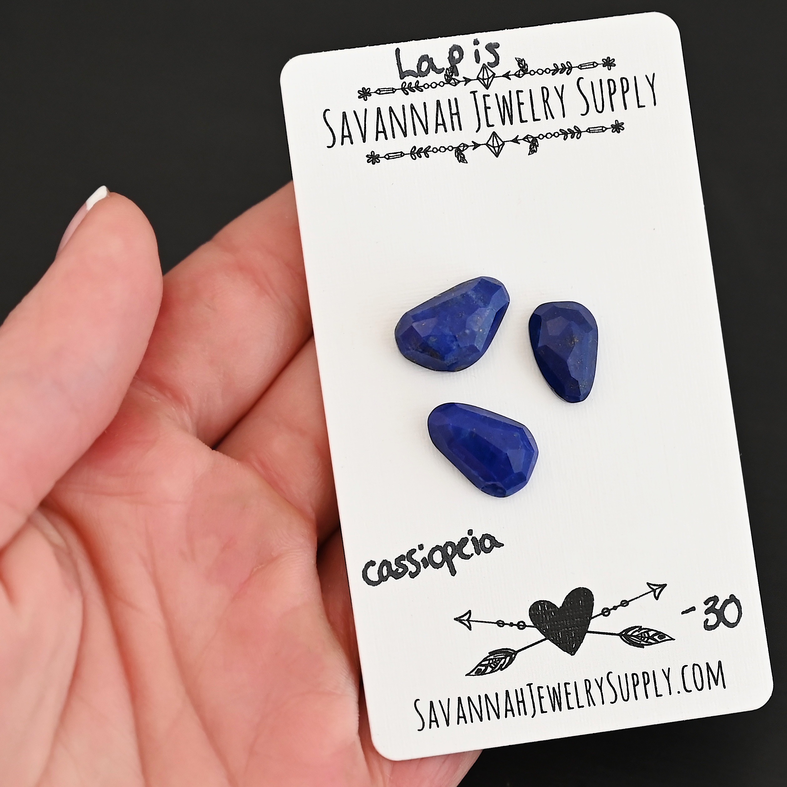 Cassiopeia Rose Cut Lapis Cabochon Parcel shown in hand