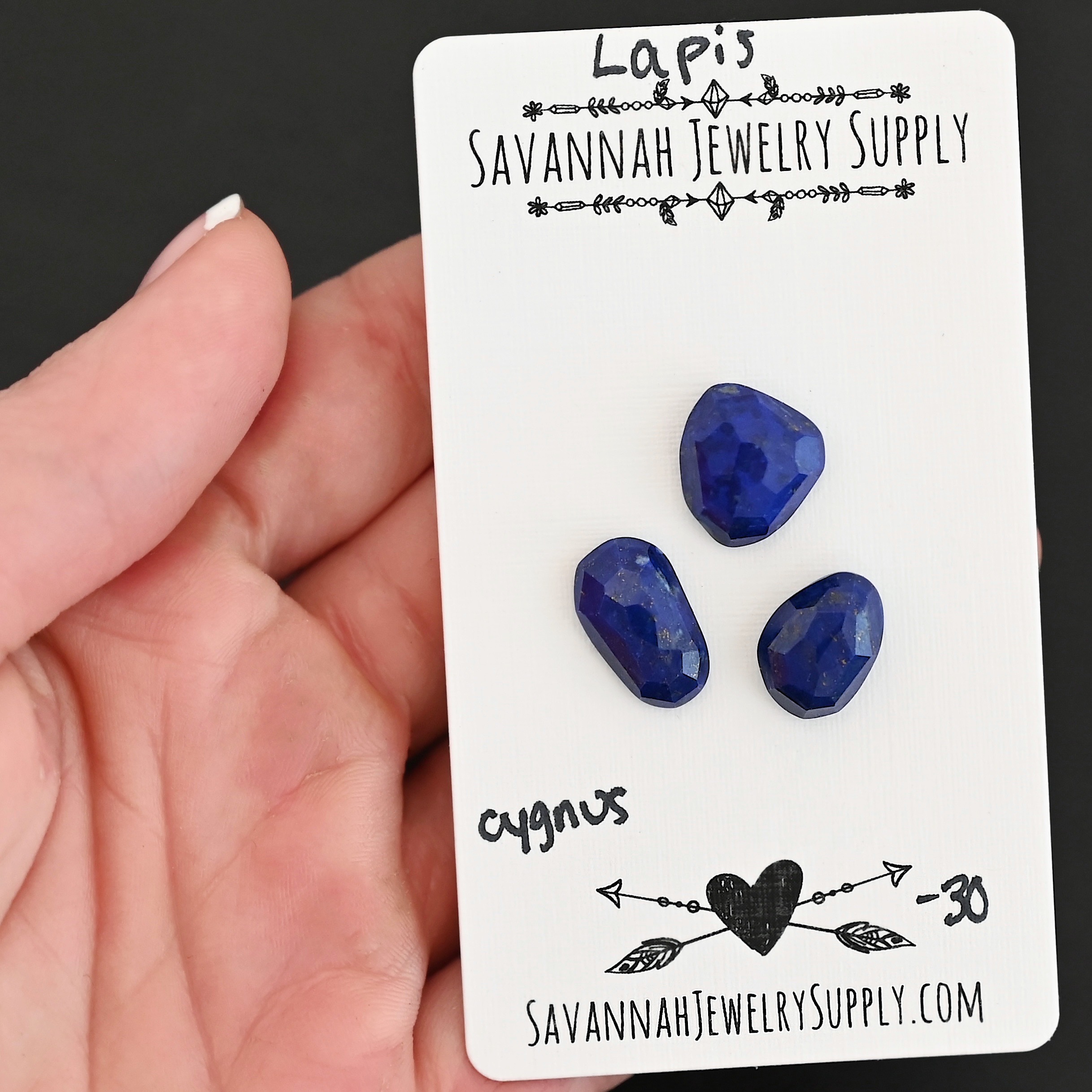 Cygnus Rose Cut Lapis Cabochon Parcel shown in hand