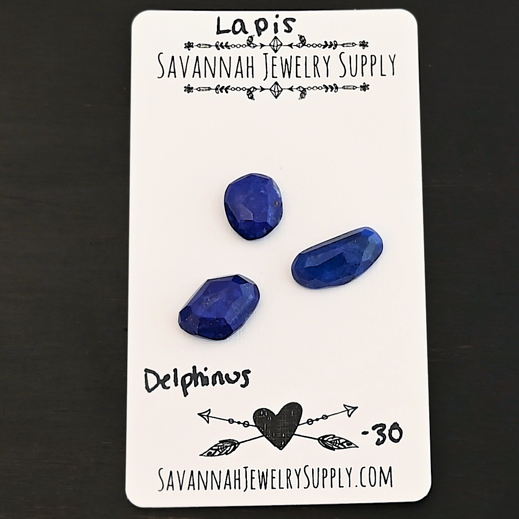 Delphinus Rose Cut Lapis Cabochon Parcel shown on business card