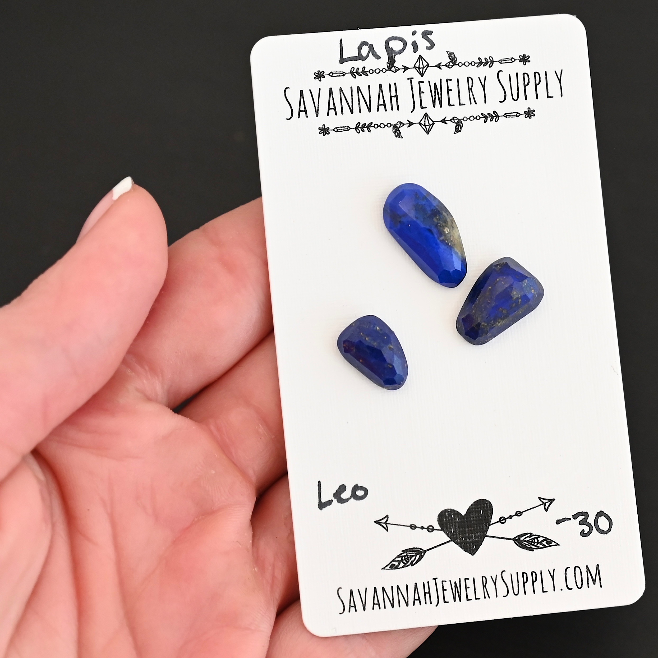 Leo Rose Cut Lapis Cabochon Parcel shown in hand