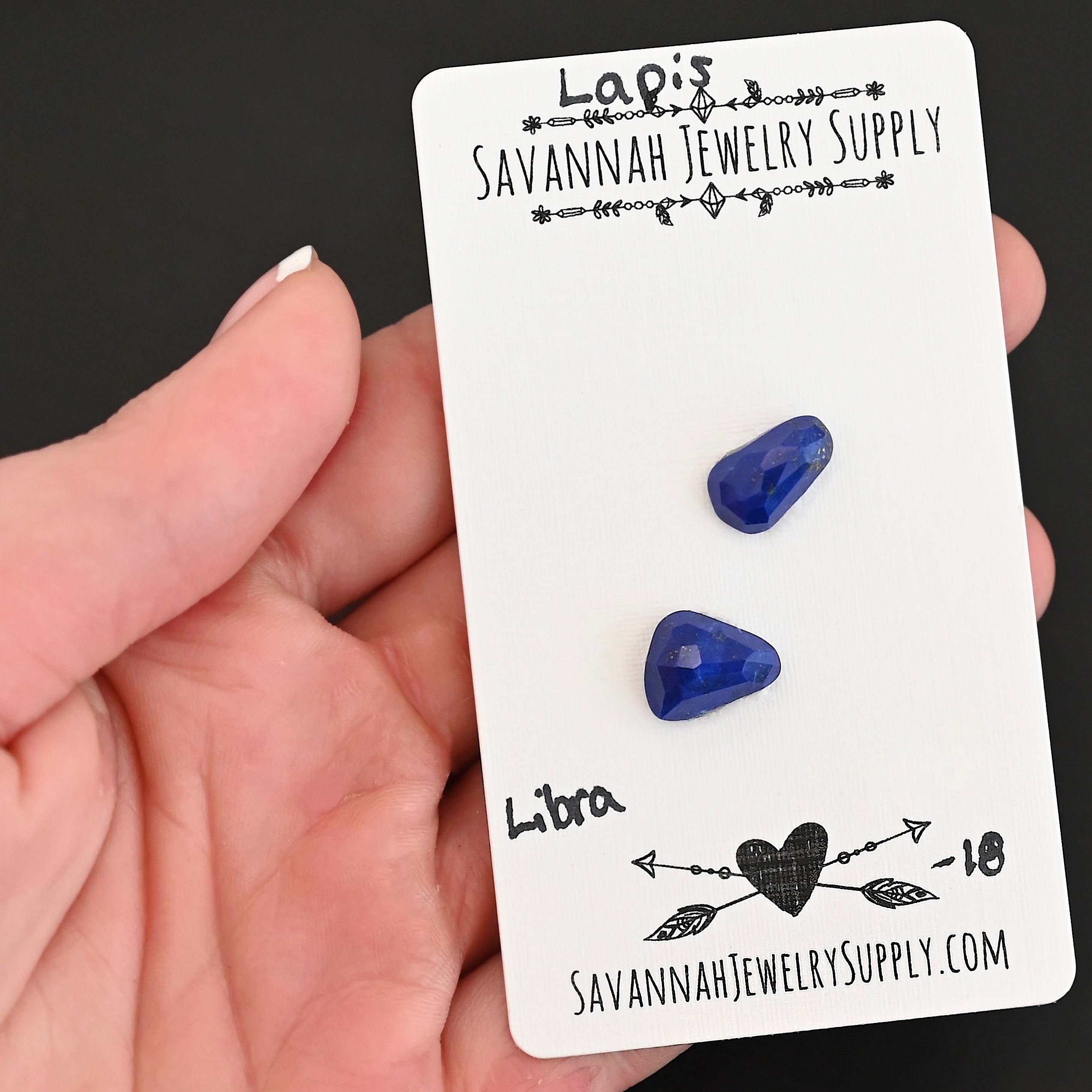 Libra Rose Cut Lapis Cabochon Parcel shown in hand
