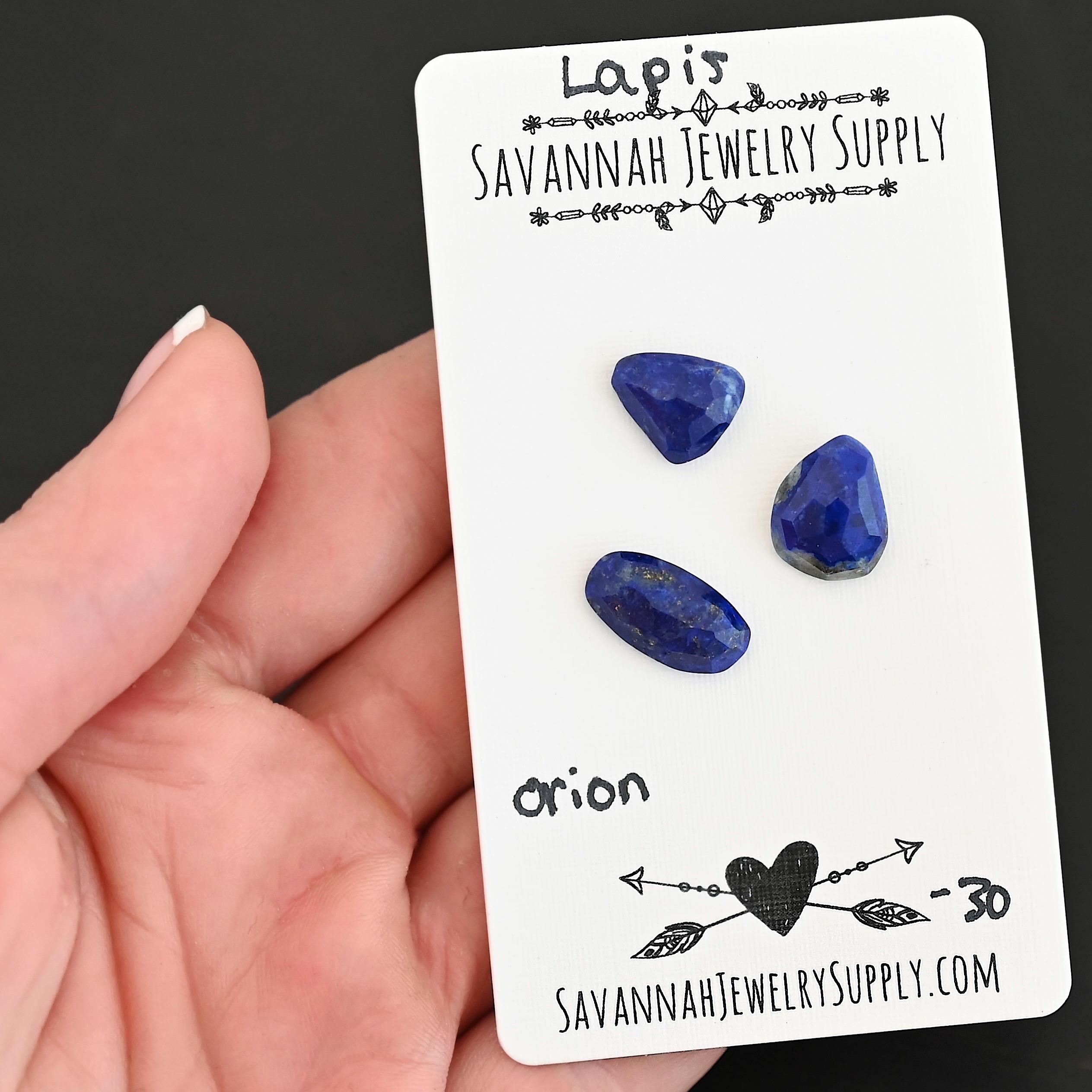 Orion Rose Cut Lapis Cabochon Parcel shown in hand