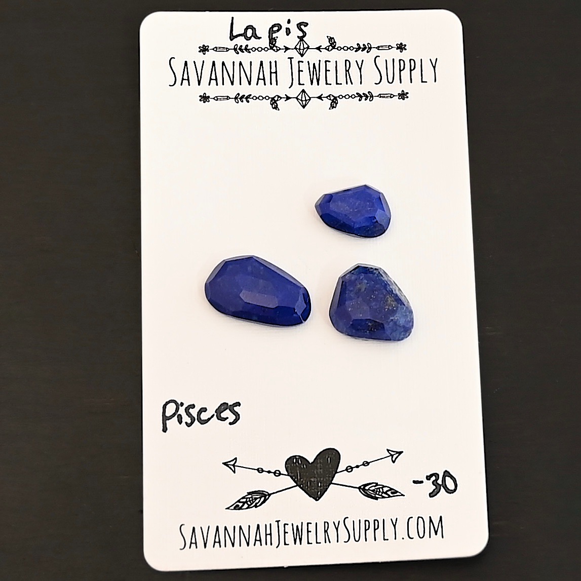 Pisces Rose Cut Lapis Cabochon Parcel shown on business card