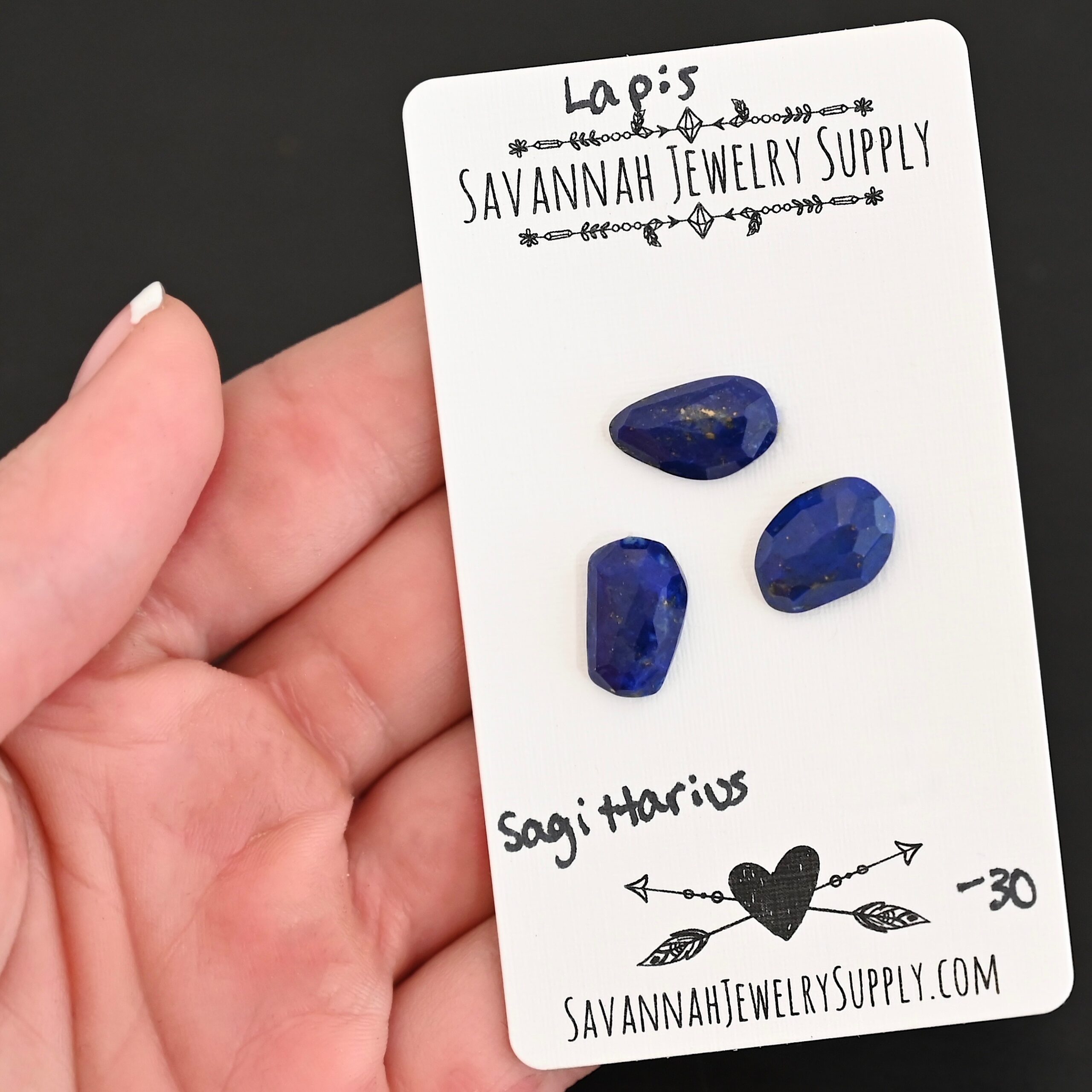 Sagittarius Rose Cut Lapis Cabochon Parcel shown in hand