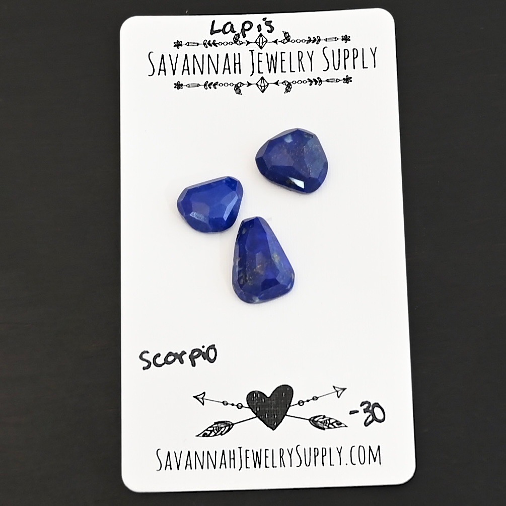 Scorpio Rose Cut Lapis Cabochon Parcel shown on business card