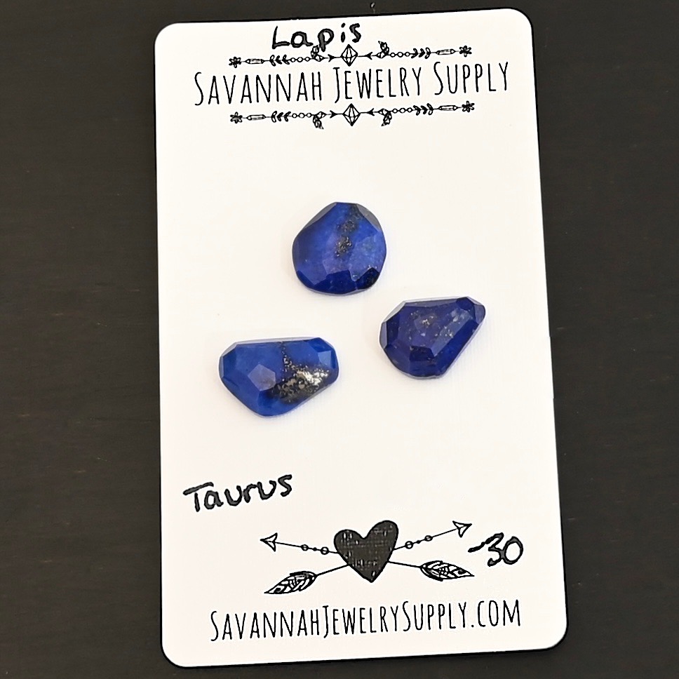 Taurus Rose Cut Lapis Cabochon Parcel shown on business card
