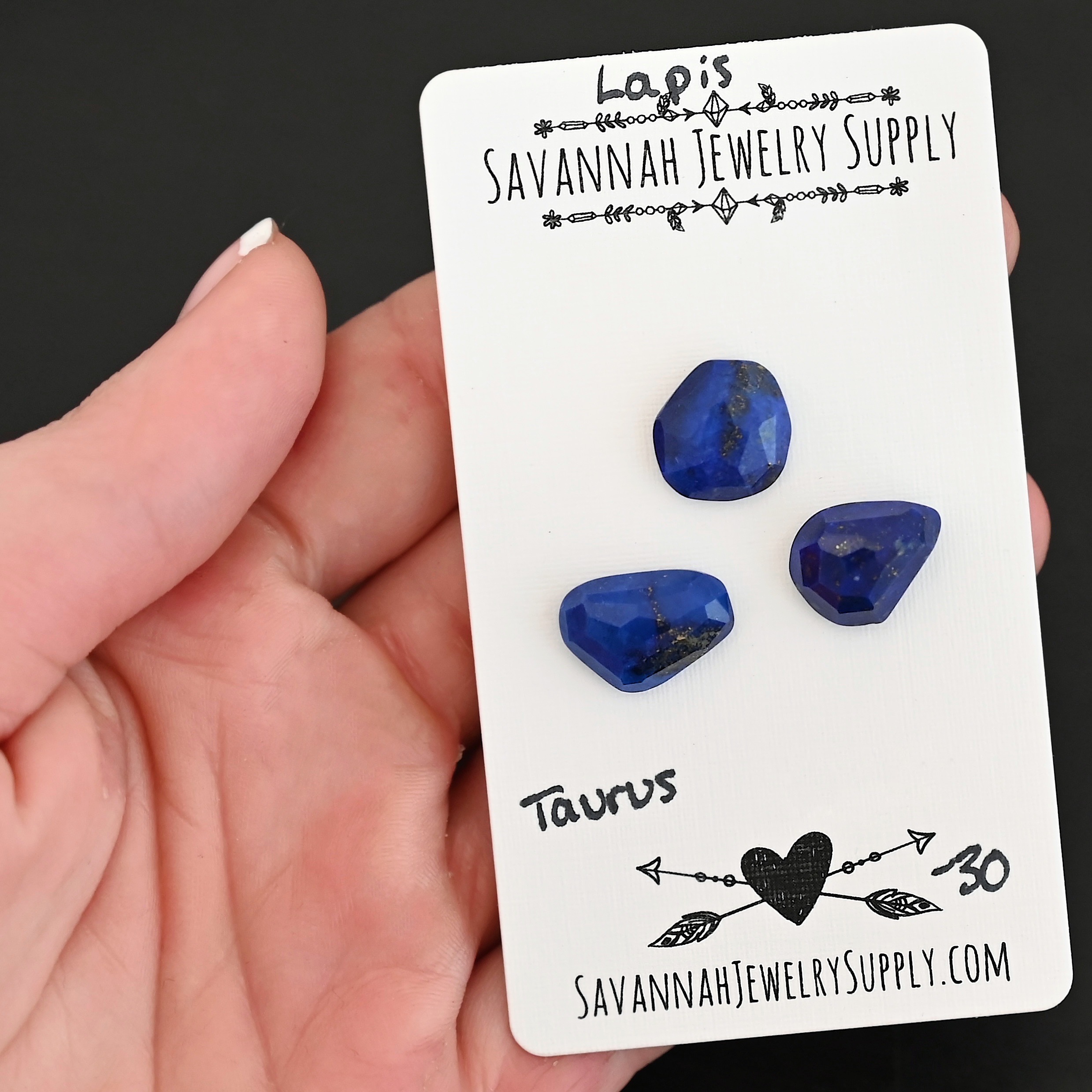 Taurus Rose Cut Lapis Cabochon Parcel shown in hand