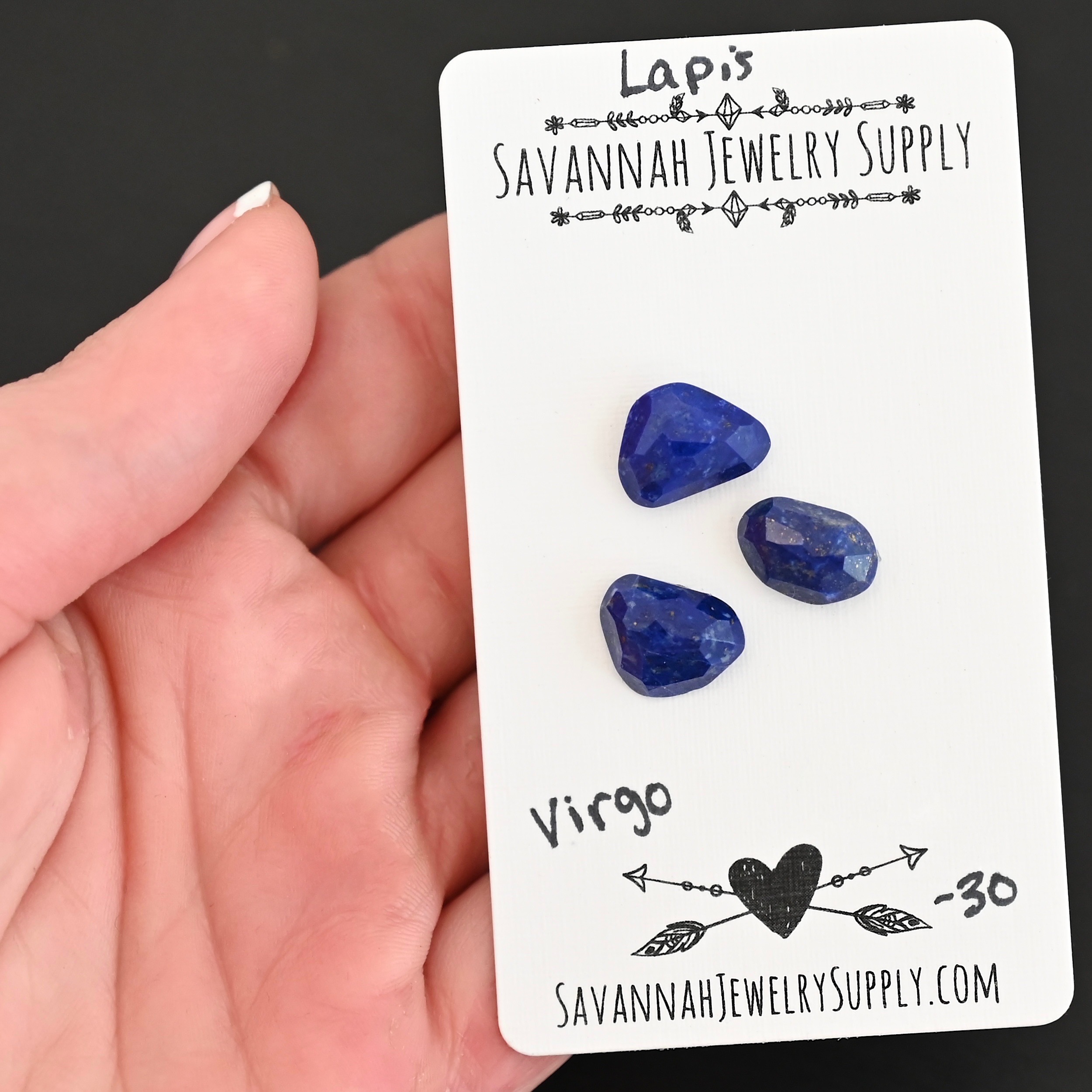 Virgo Rose Cut Lapis Cabochon Parcel shown in hand