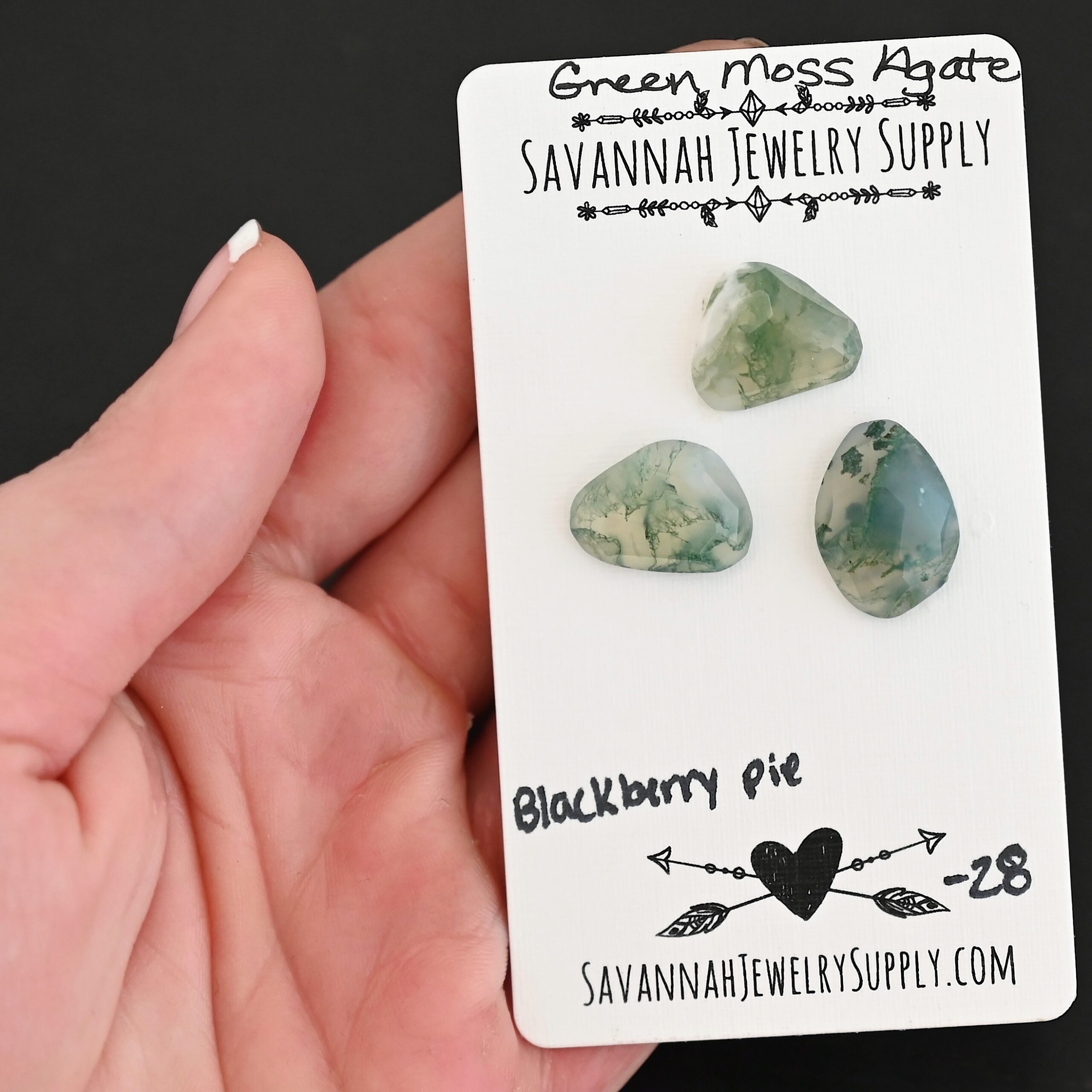Blackberry Pie Rose Cut Green Moss Agate Cabochon Parcel shown in hand