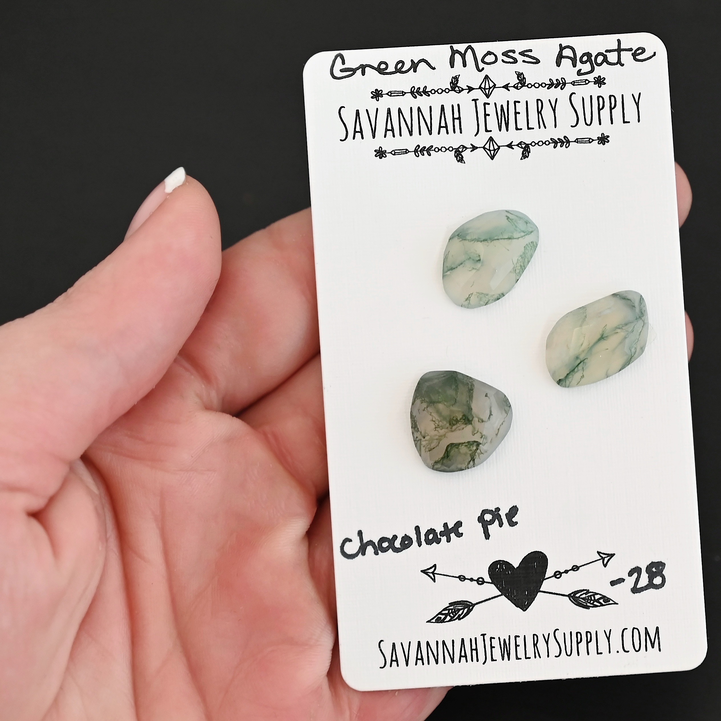 Chocolate Pie Rose Cut Green Moss Agate Cabochon Parcel shown in hand