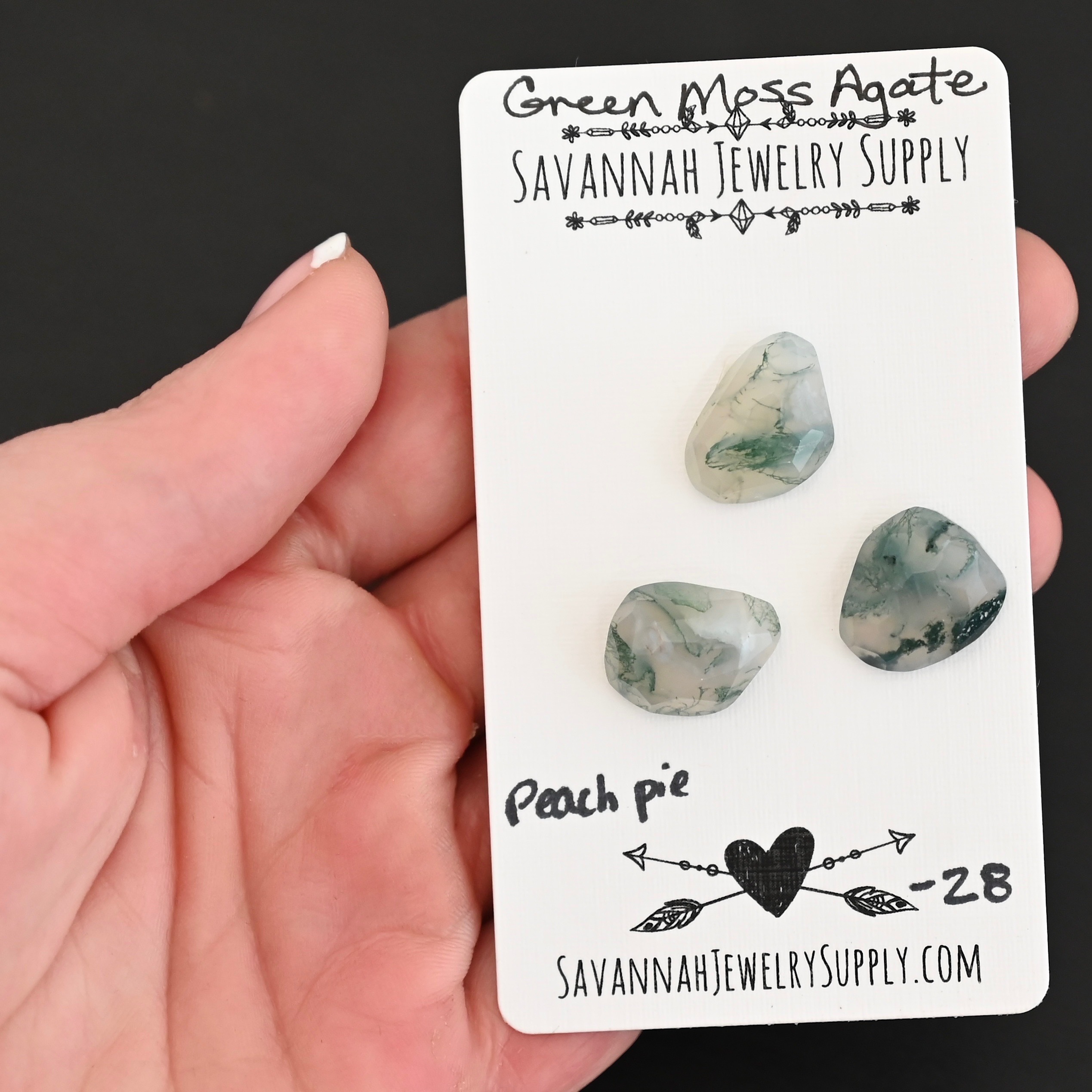 Peach Pie Rose Cut Green Moss Agate Cabochon Parcel shown in hand