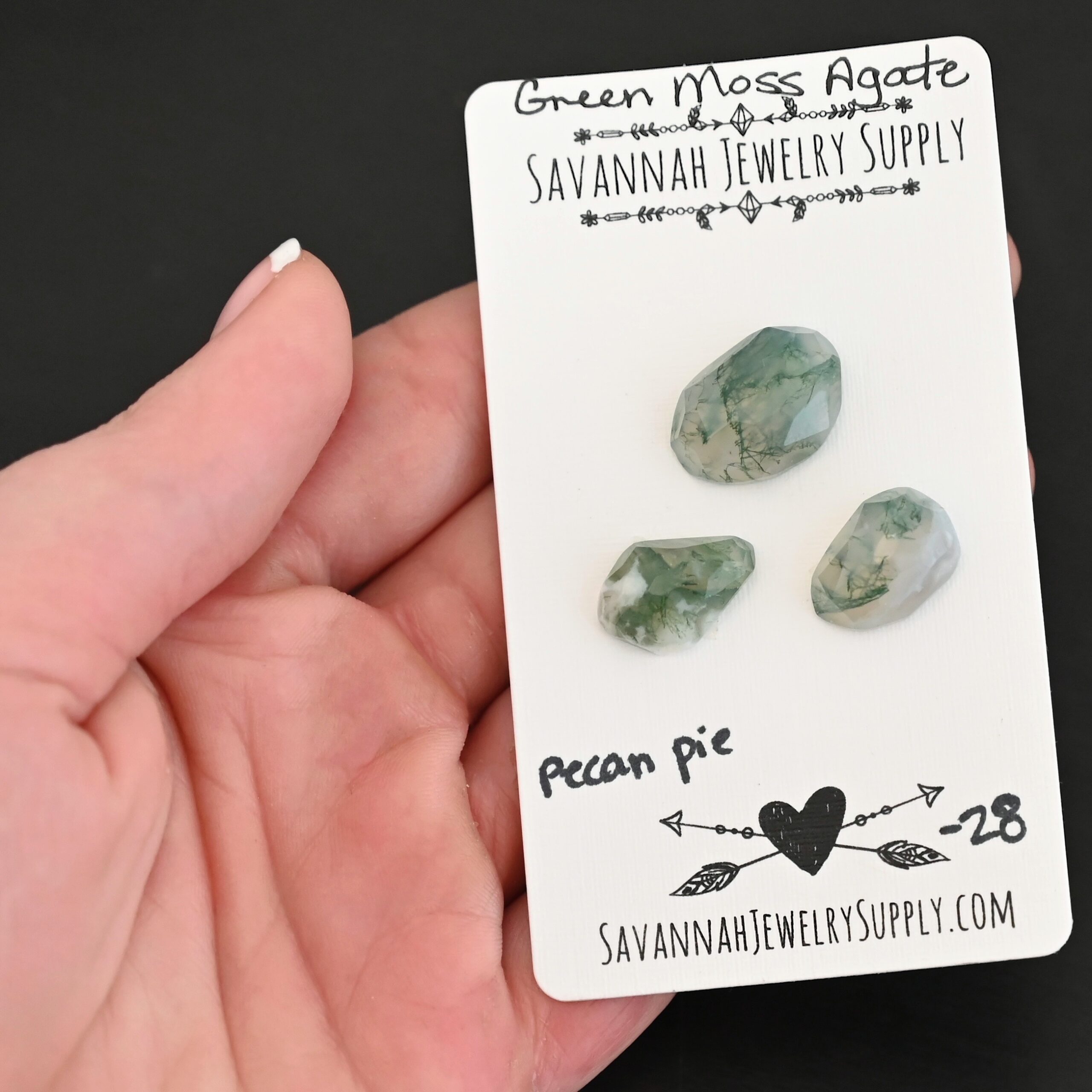 Pecan Pie Rose Cut Green Moss Agate Cabochon Parcel shown in hand