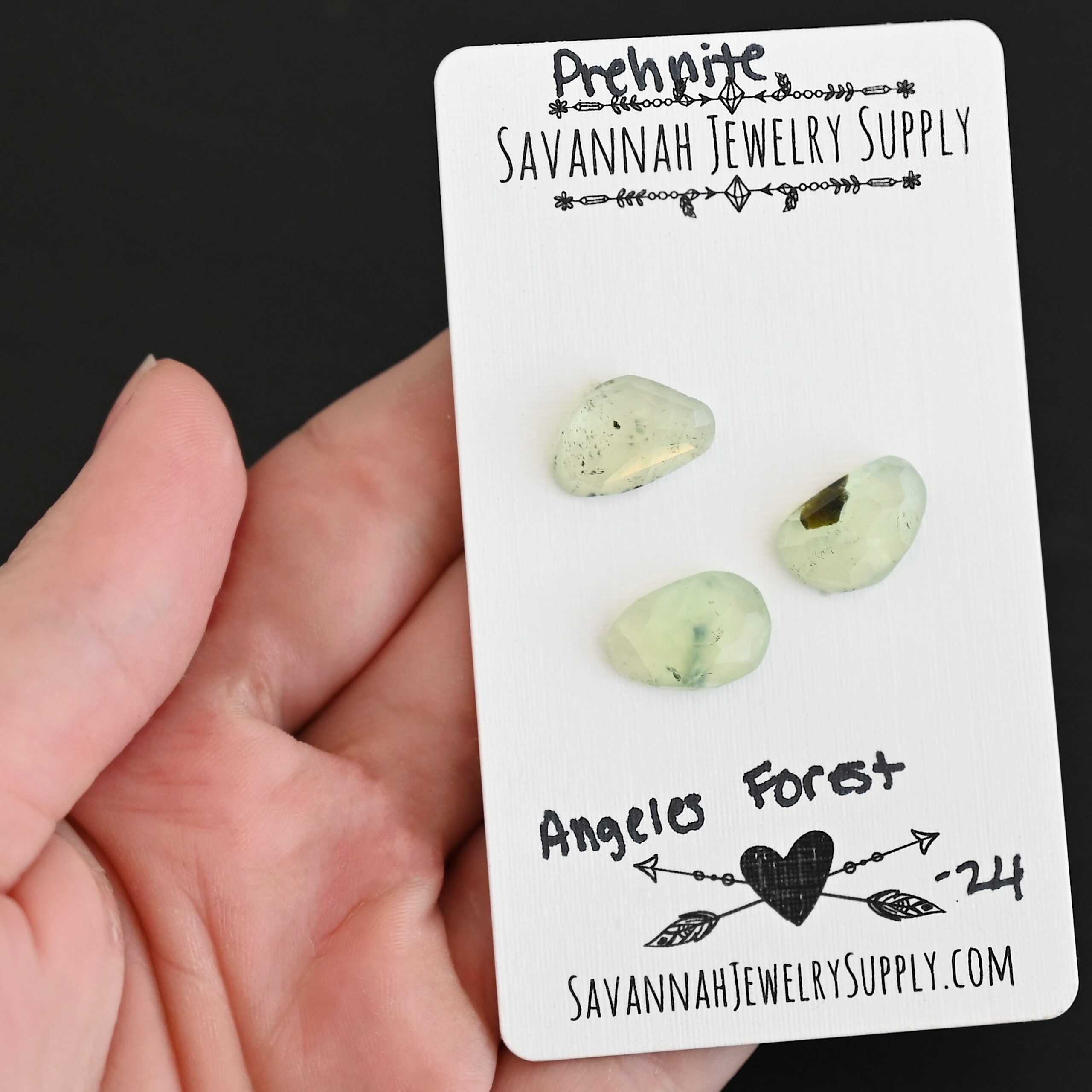 Angeles Forest Rose Cut Prehnite Cabochon Parcel shown in hand