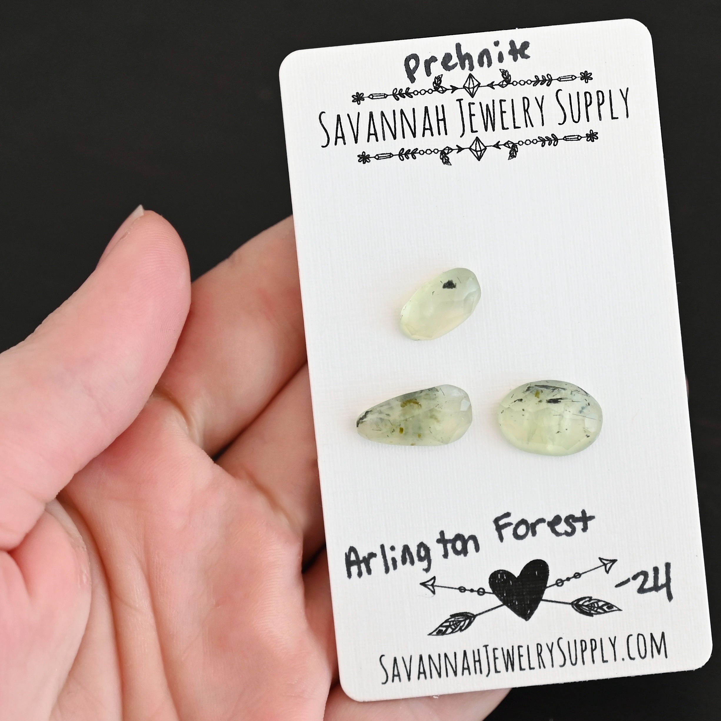 Arlington Forest Rose Cut Prehnite Cabochon Parcel shown in hand