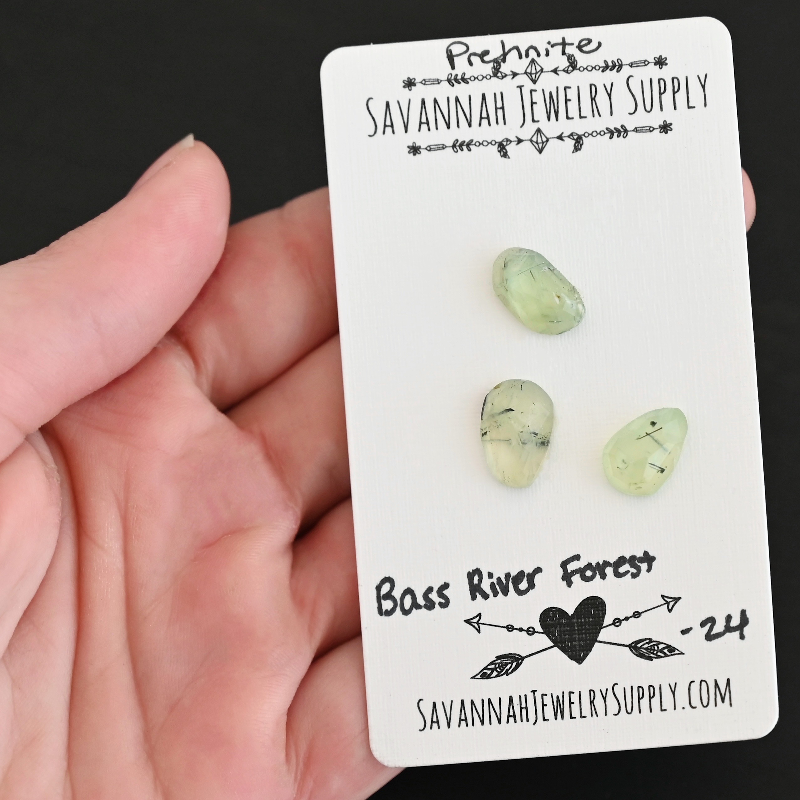 Bass River Forest Rose Cut Prehnite Cabochon Parcel shown in hand