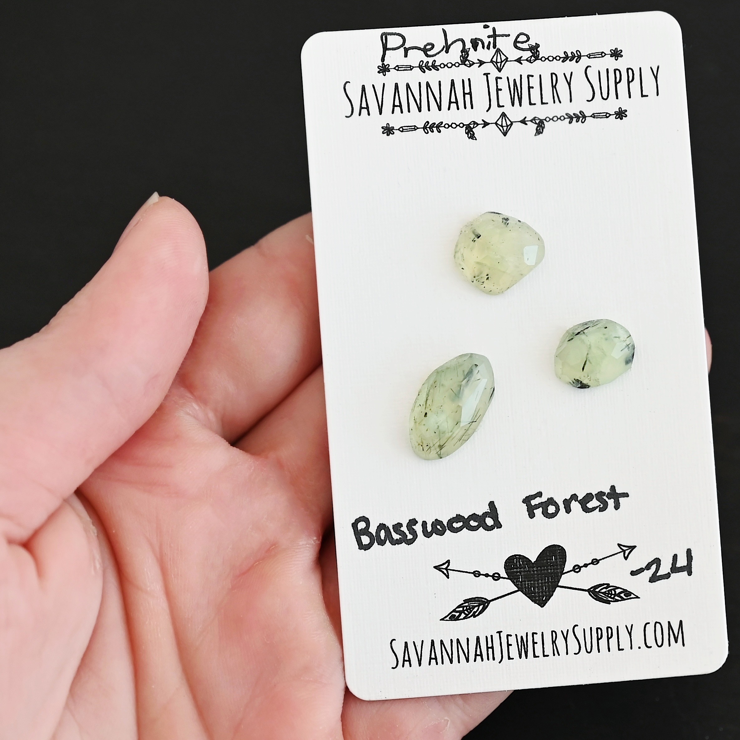 Basswood Forest Rose Cut Prehnite Cabochon Parcel shown in hand