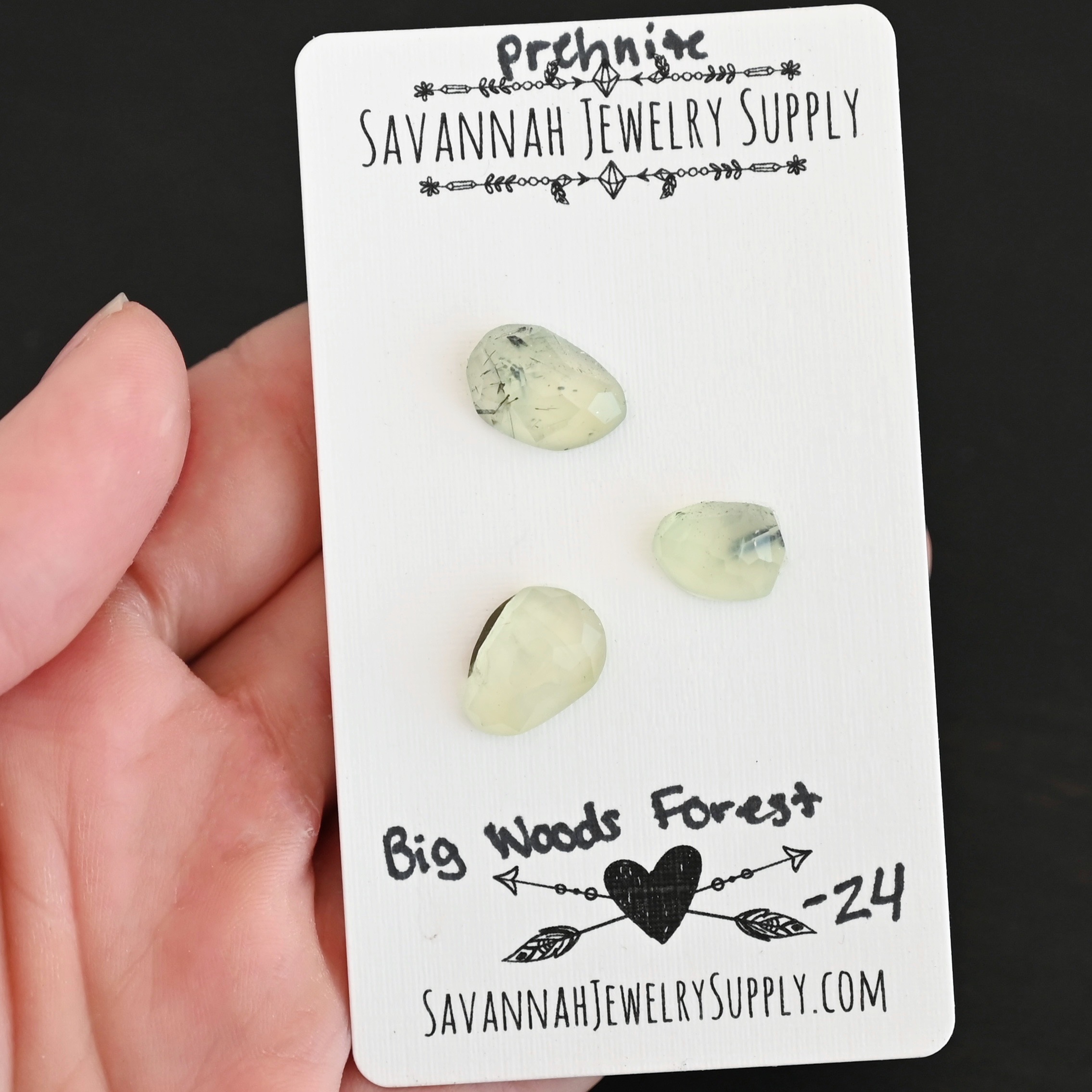 Big Woods Forest Rose Cut Prehnite Cabochon Parcel shown in hand