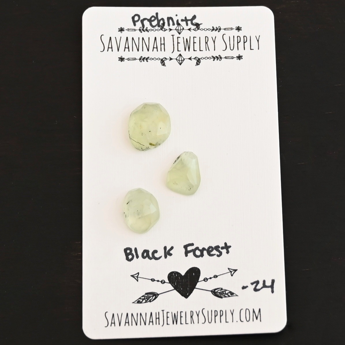 Black Forest Rose Cut Prehnite Cabochon Parcel shown on business card