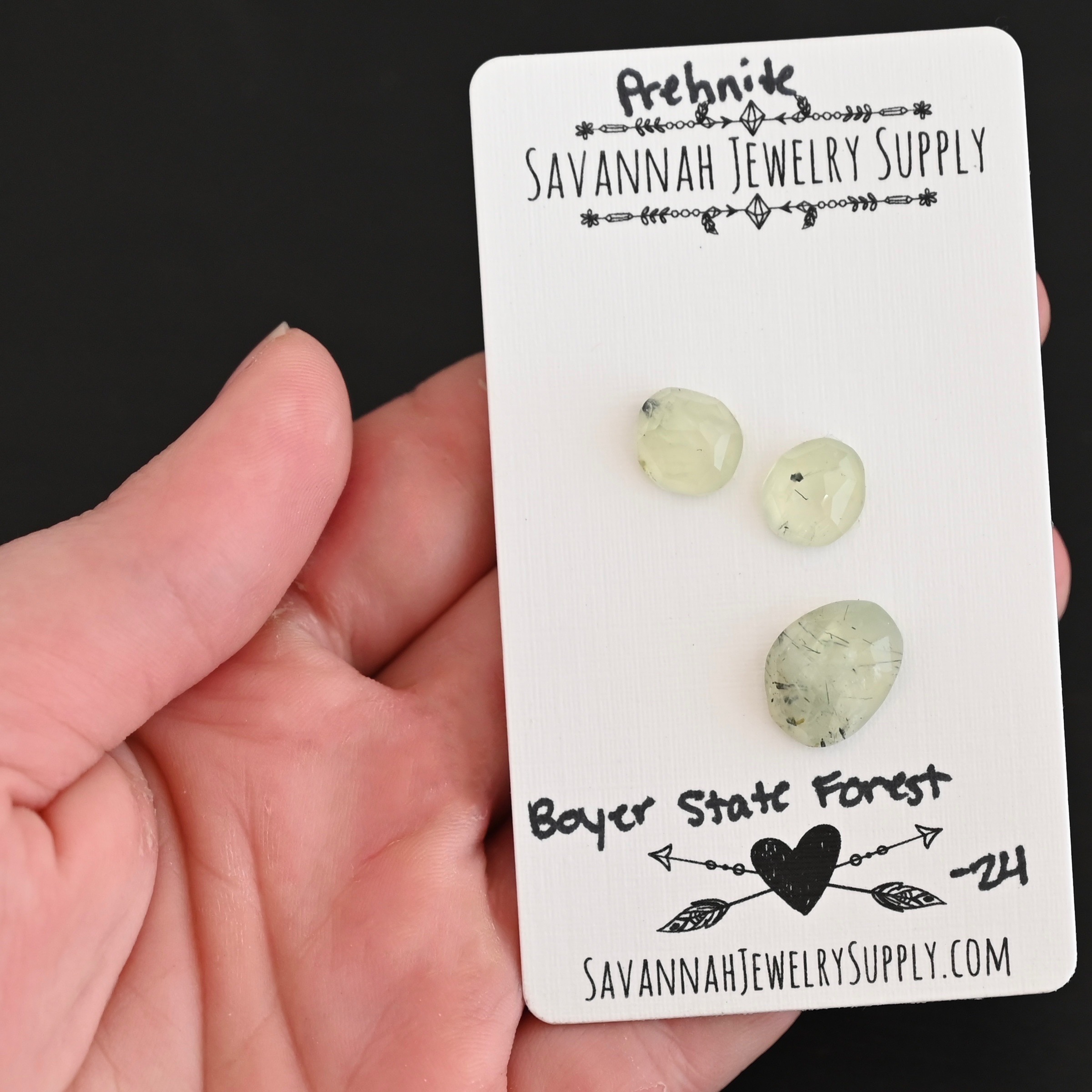 Boyer State Forest Rose Cut Prehnite Cabochon Parcel shown in hand