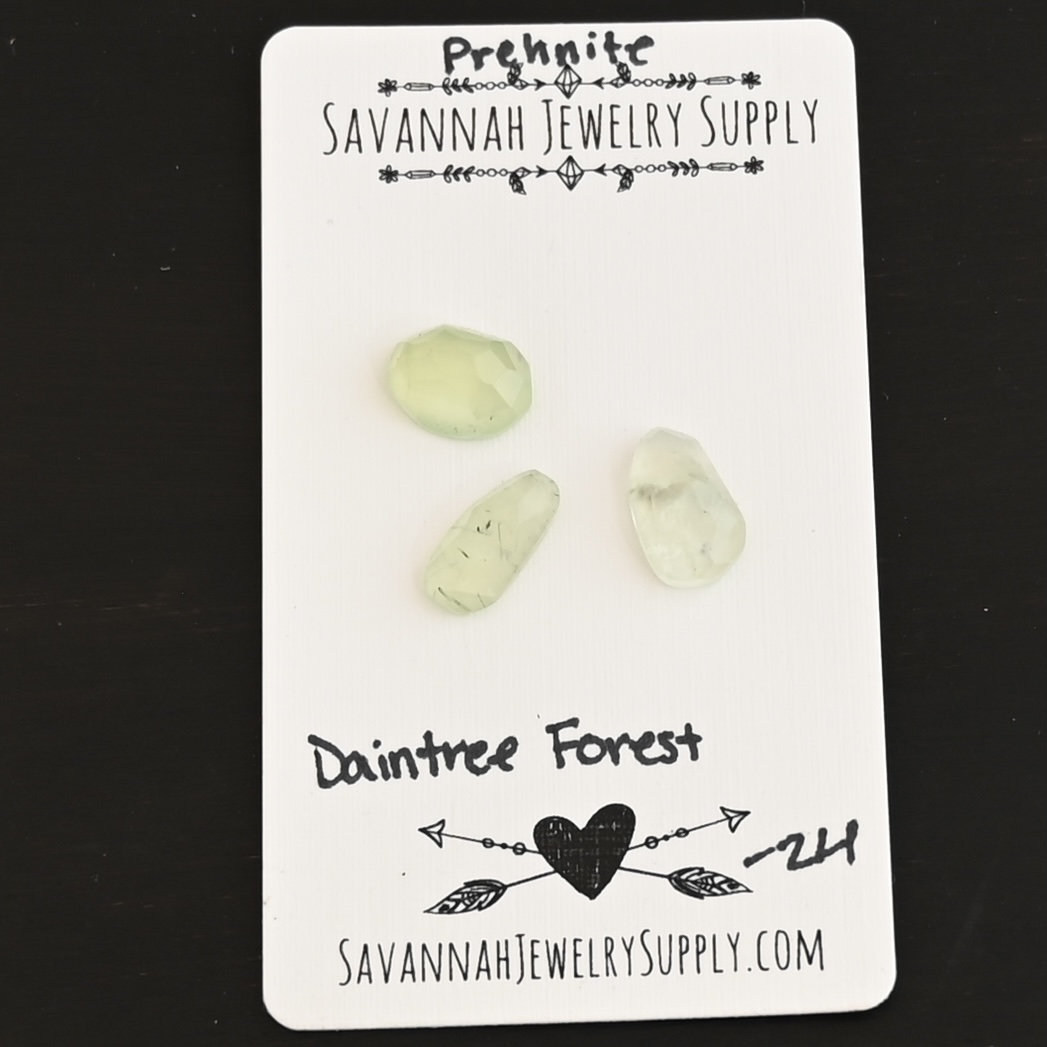 Daintree Forest Rose Cut Prehnite Cabochon Parcel shown on business card