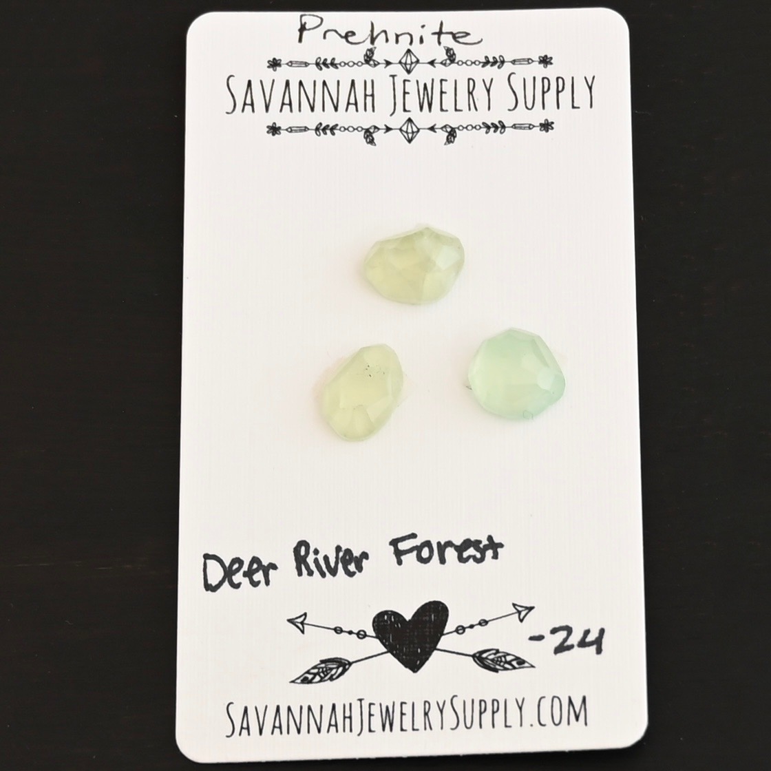 Deer River Forest Rose Cut Prehnite Cabochon Parcel shown on business card