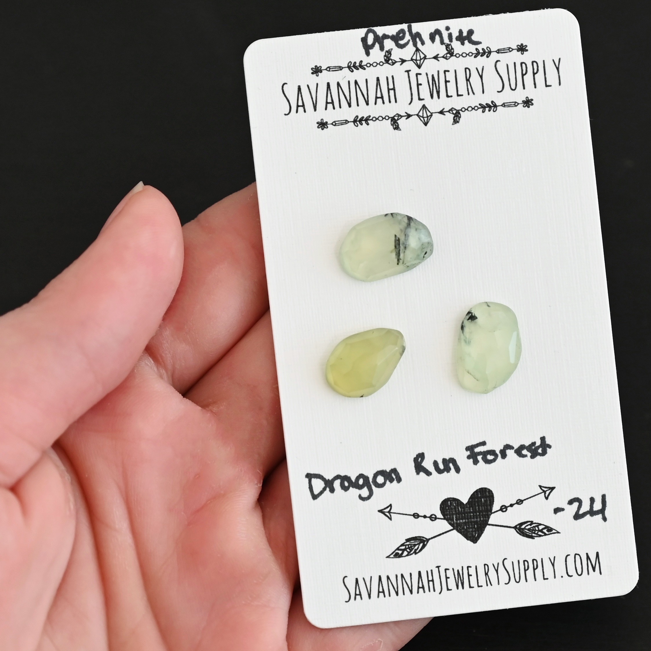 Dragon Run Forest Rose Cut Prehnite Cabochon Parcel shown in hand