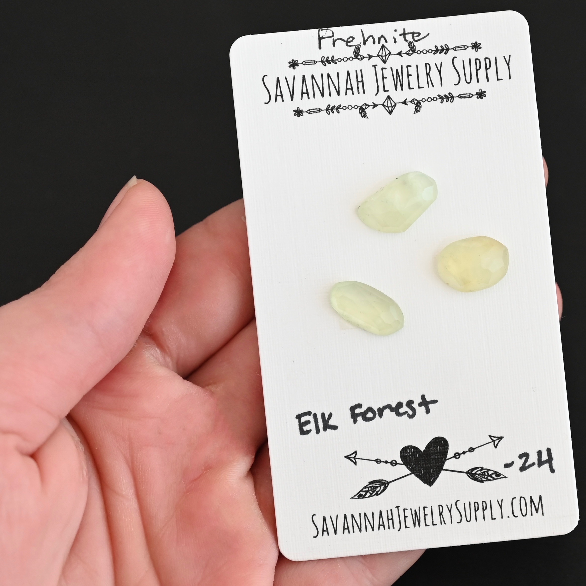 Elk Forest Rose Cut Prehnite Cabochon Parcel shown in hand