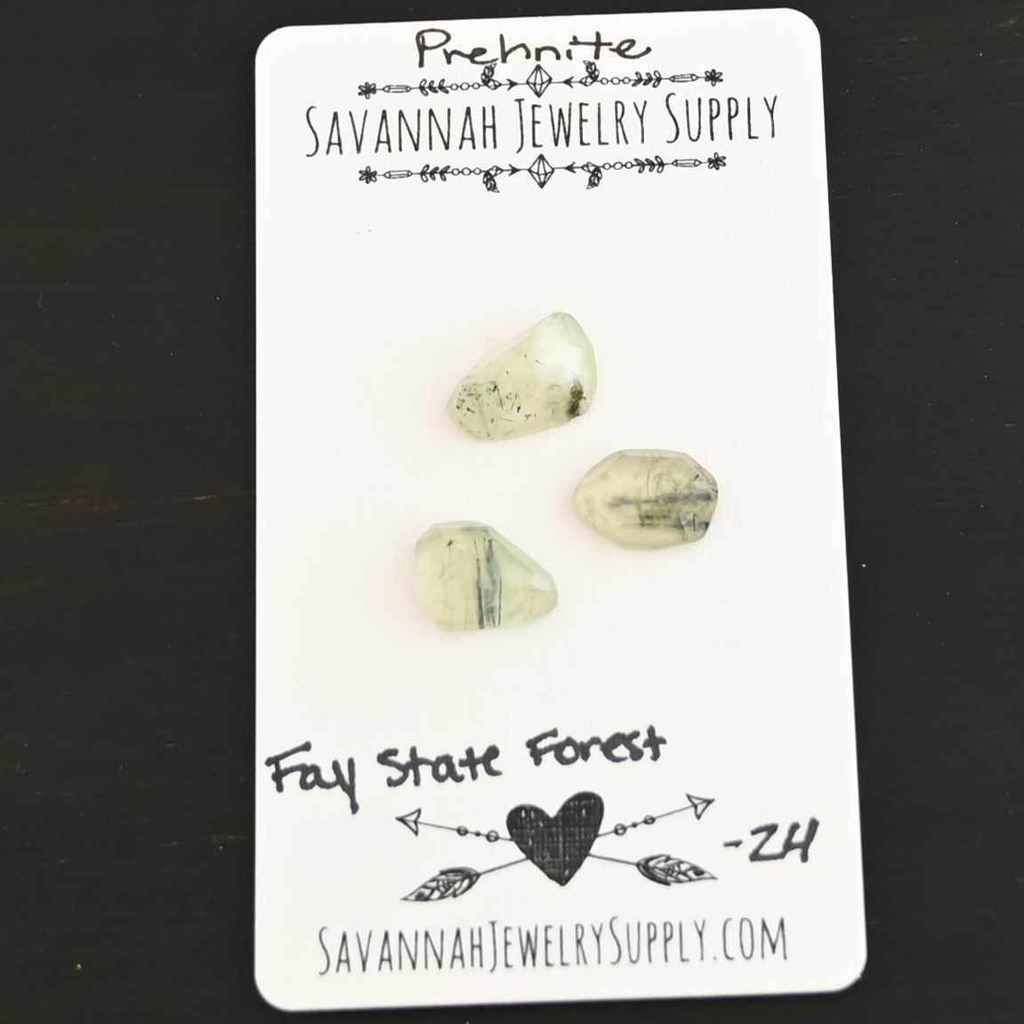 Fay State Forest Rose Cut Prehnite Cabochon Parcel shown on business card