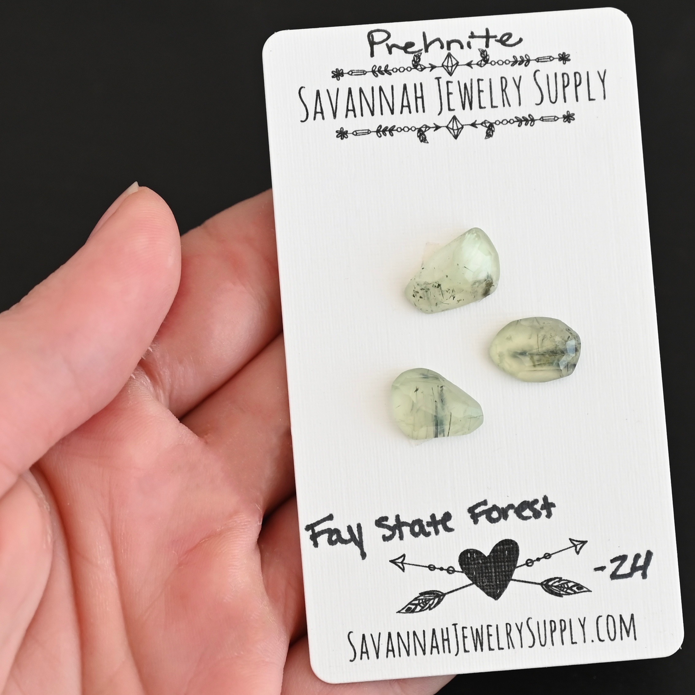 Fay State Forest Rose Cut Prehnite Cabochon Parcel shown in hand