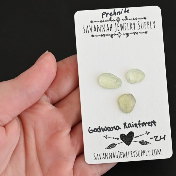 Gondwana RainForest Rose Cut Prehnite Cabochon Parcel shown in hand