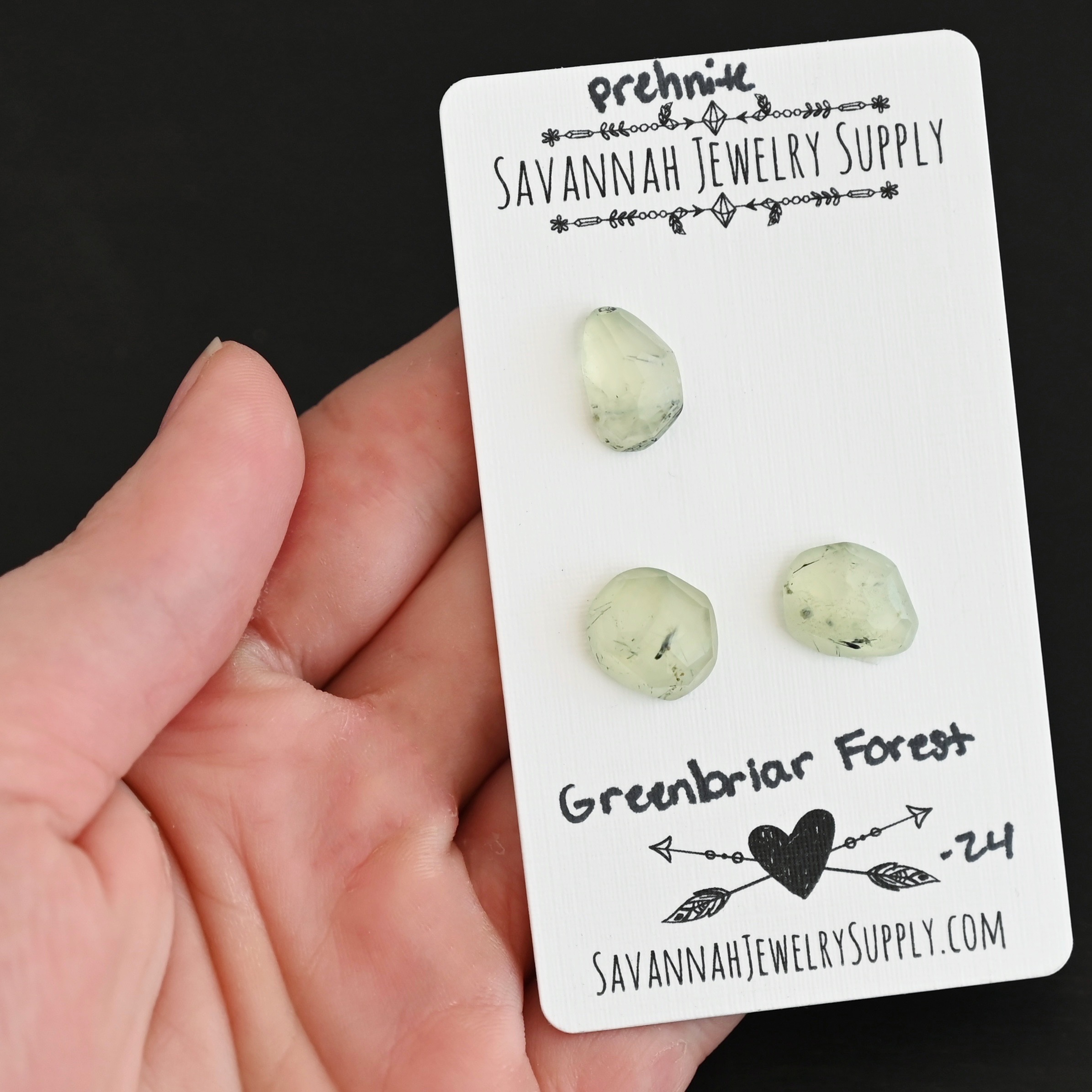 Greenbriar Forest Rose Cut Prehnite Cabochon Parcel shown in hand