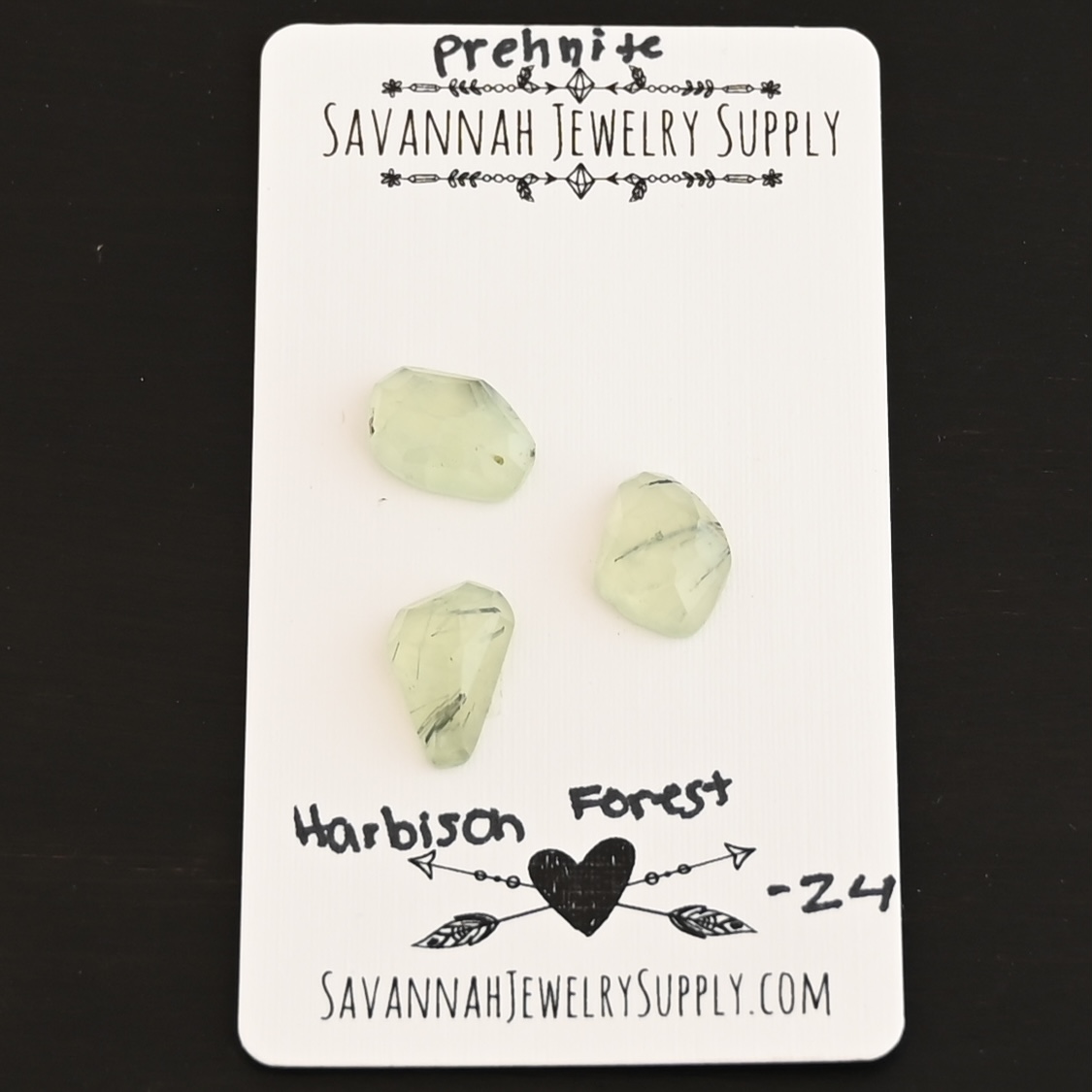 Harbison Forest Rose Cut Prehnite Cabochon Parcel shown on business card