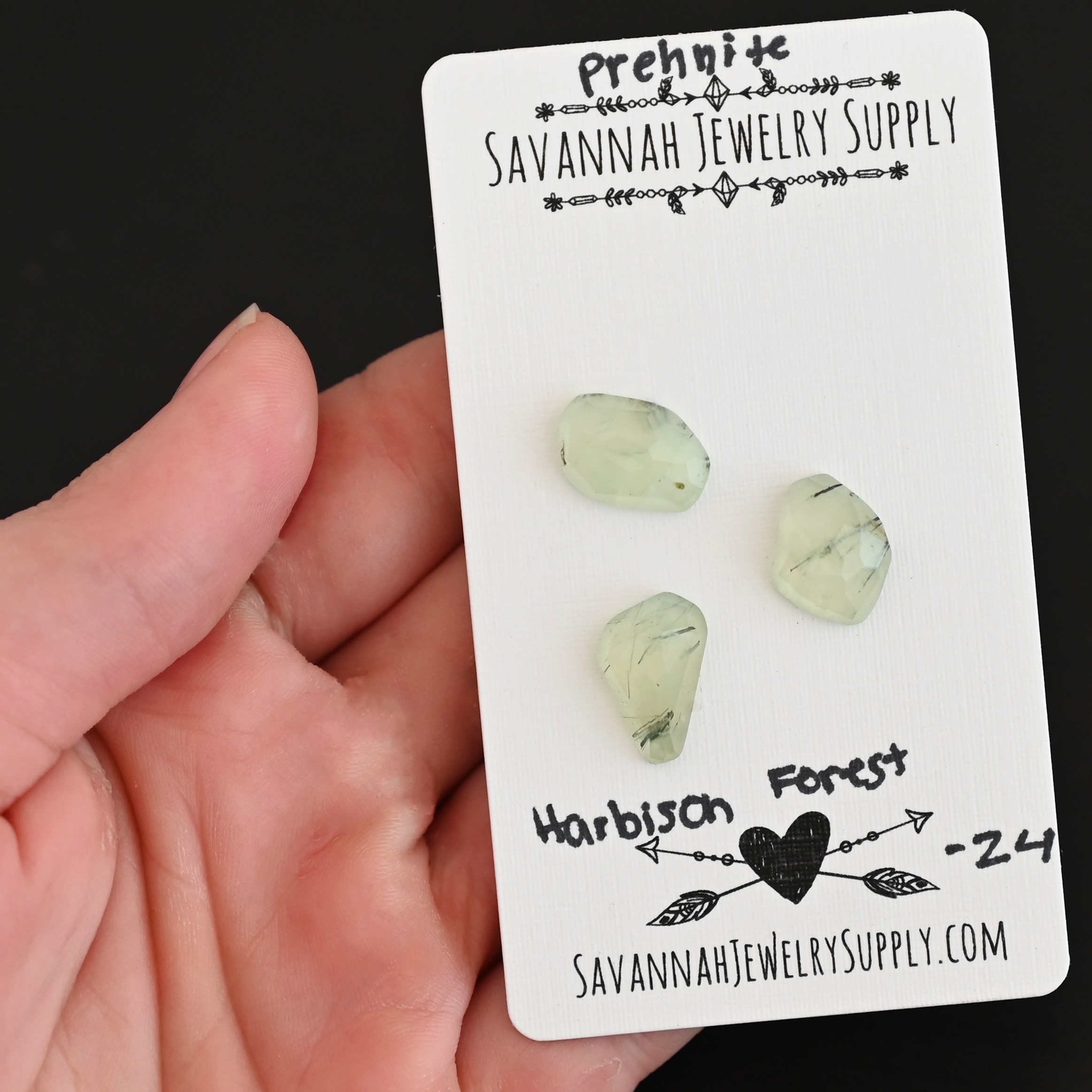 Harbison Forest Rose Cut Prehnite Cabochon Parcel shown in hand
