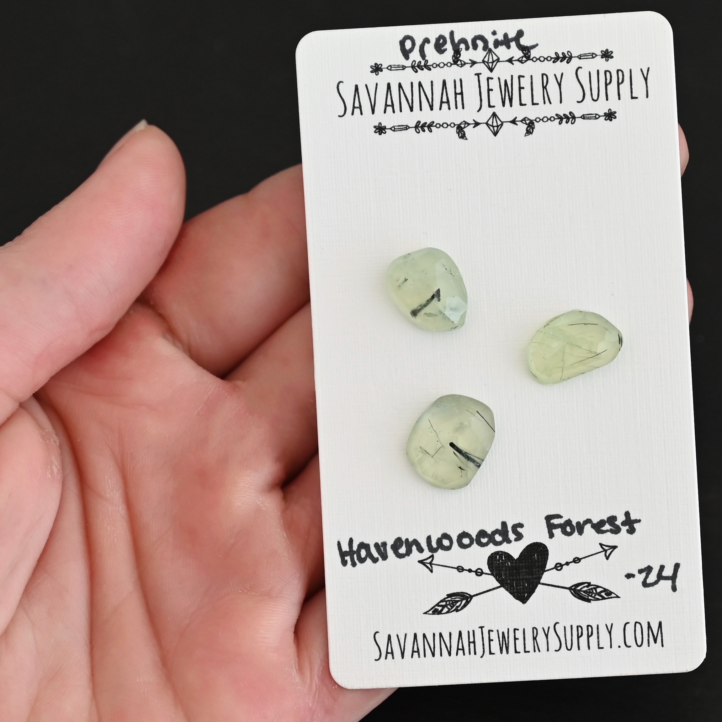 Havenwoods Forest Rose Cut Prehnite Cabochon Parcel shown in hand