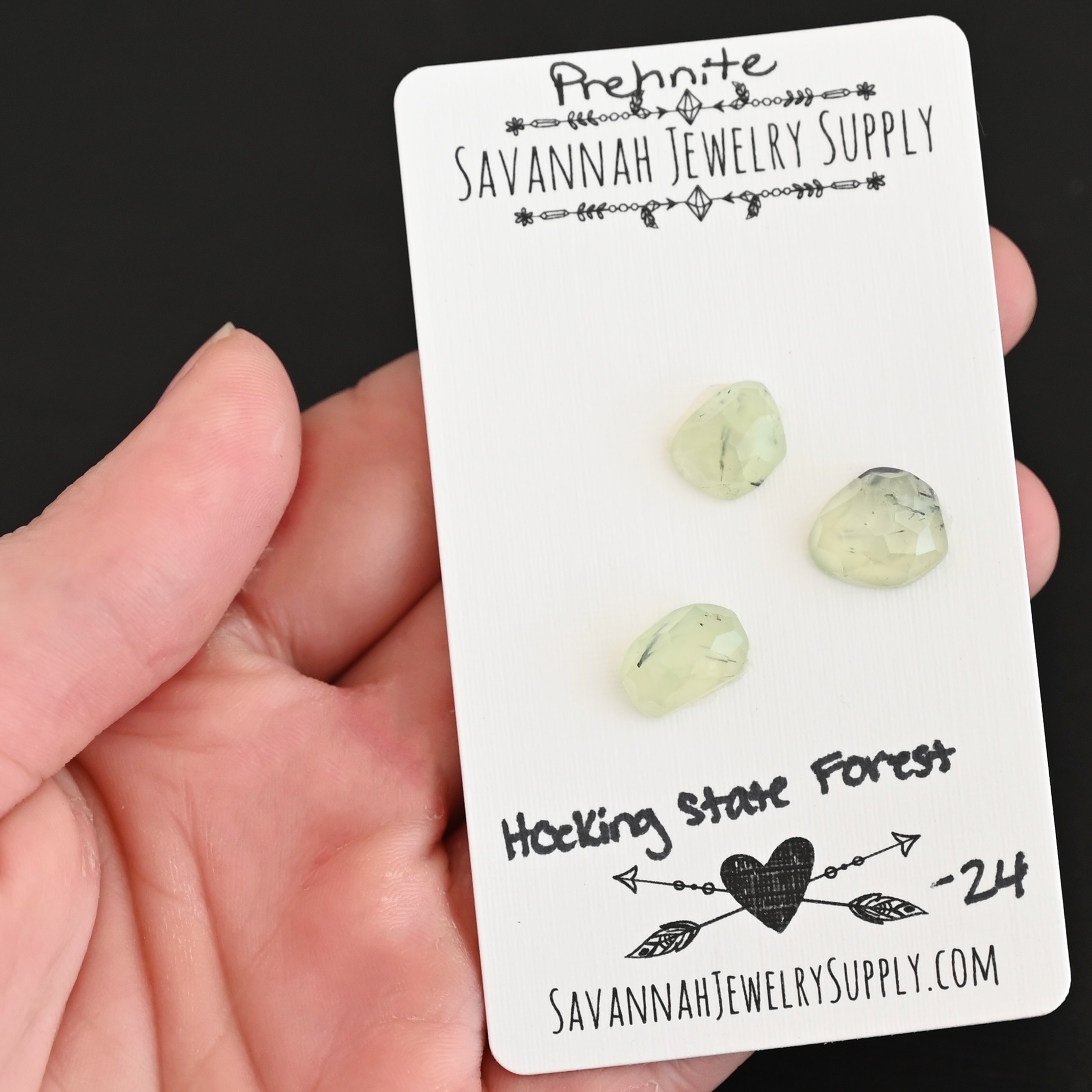 Hocking State Forest Rose Cut Prehnite Cabochon Parcel shown in hand